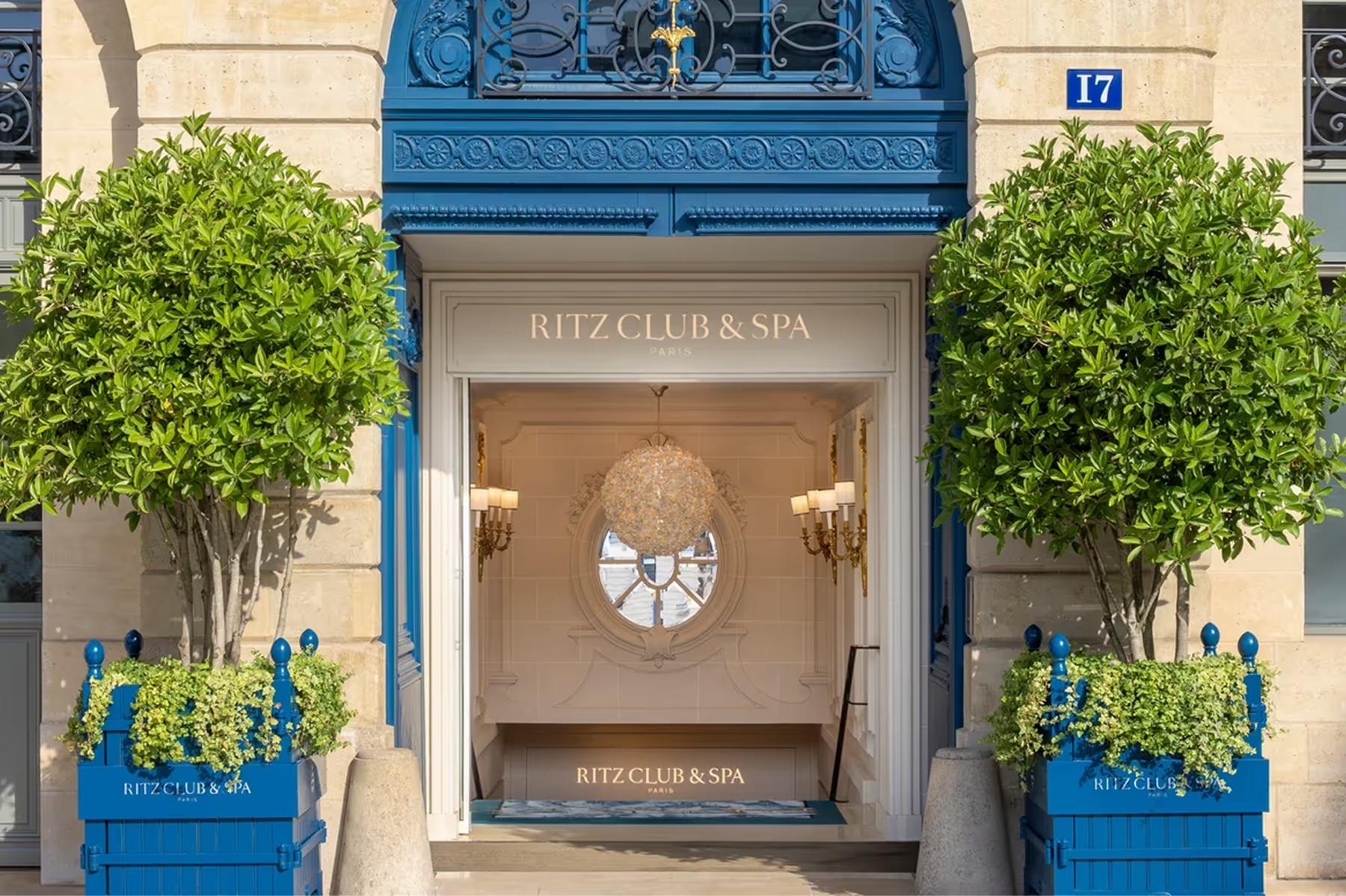 Ritz Paris: the Ritz Club & Spa entrance with blue door, topiary flanking, and street-level signage
