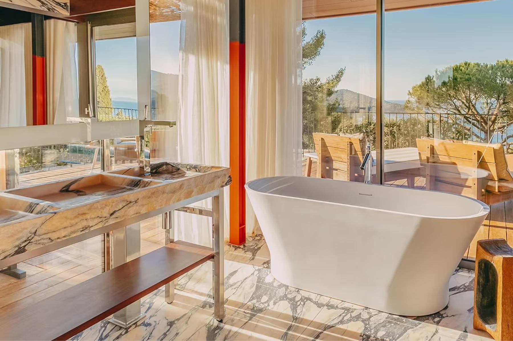 Lily of the Valley: spa bathroom with white soaking tub and morning light from windows