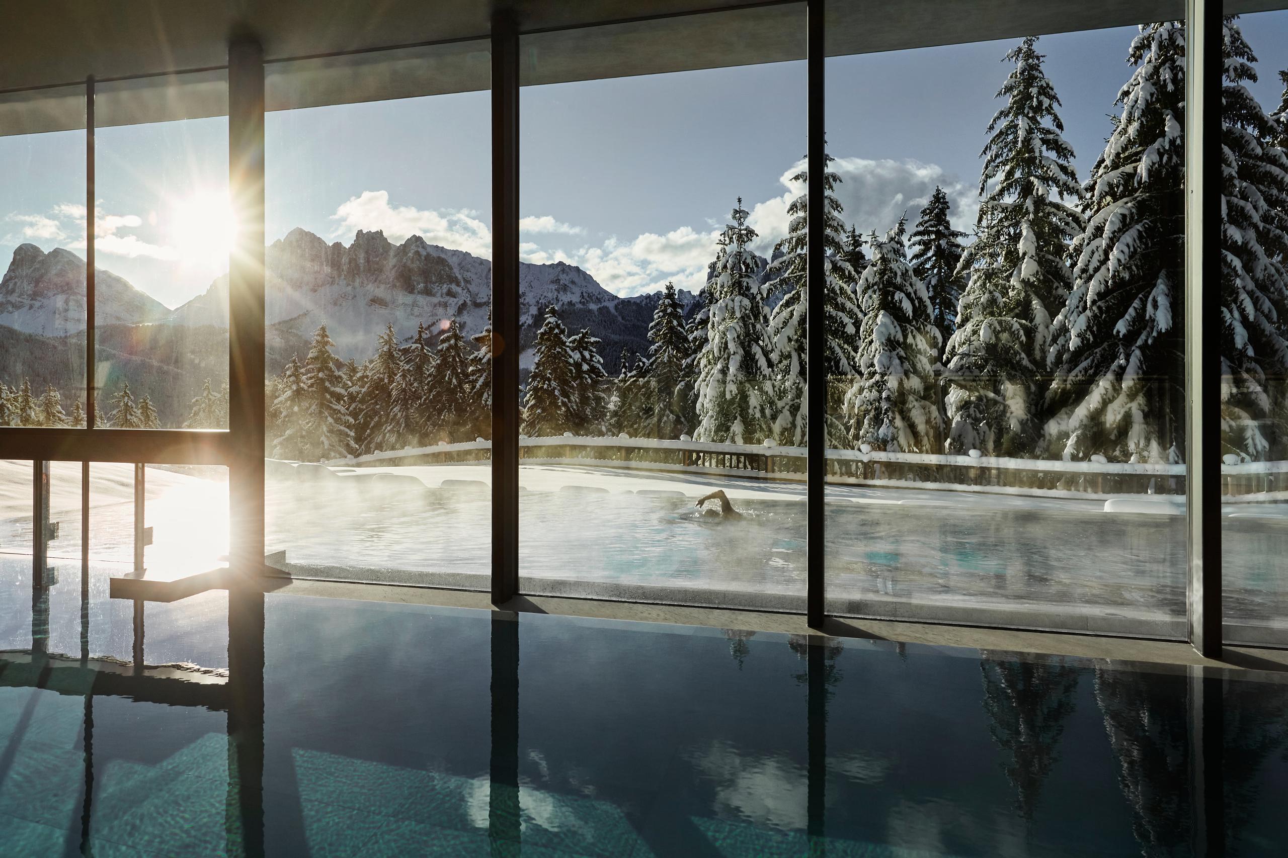 Forestis: a heated pool or water therapy area with light wood surrounds and calm spa-like ambiance