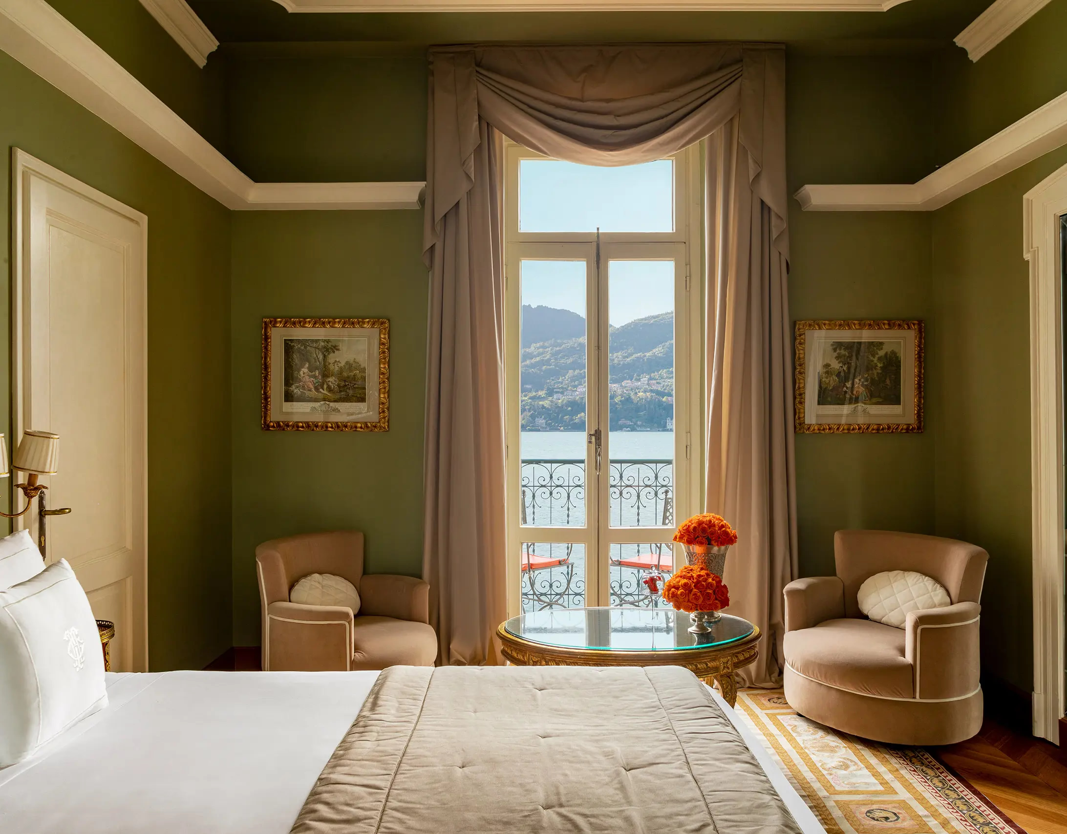 Grand Hotel Tremezzo: bedroom with sage walls, armchair seating, and balcony with lake panorama