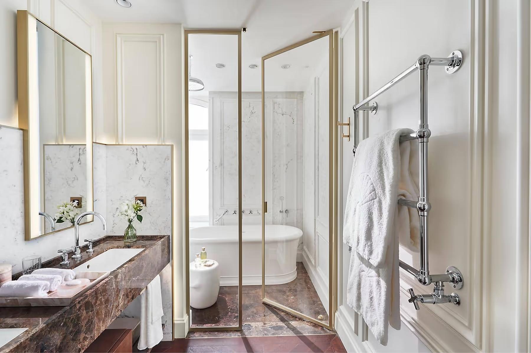 Mandarin Oriental Ritz, Madrid: marble bathroom with glass-enclosed shower and heated towel racks