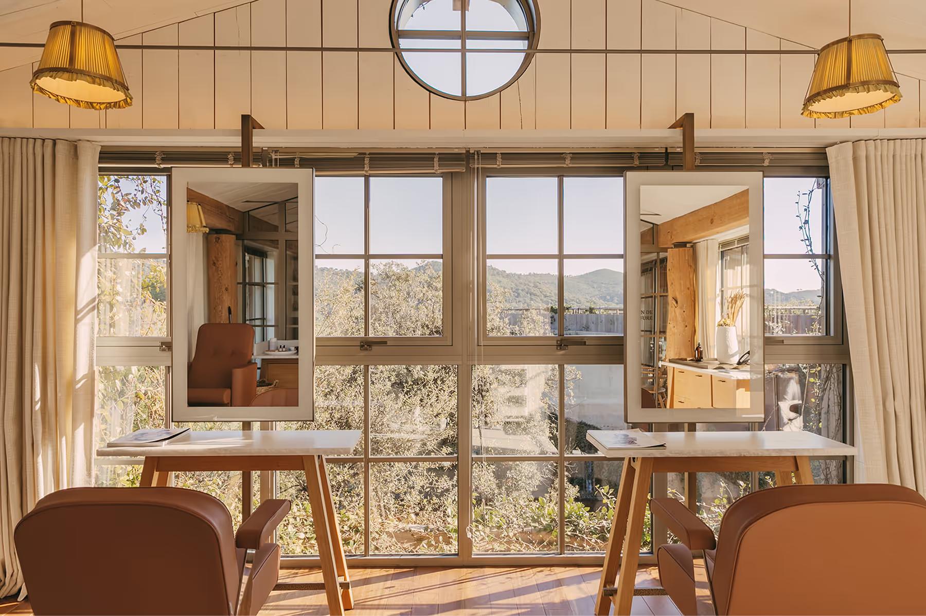 Wellness studio with pendant lights and large windows
