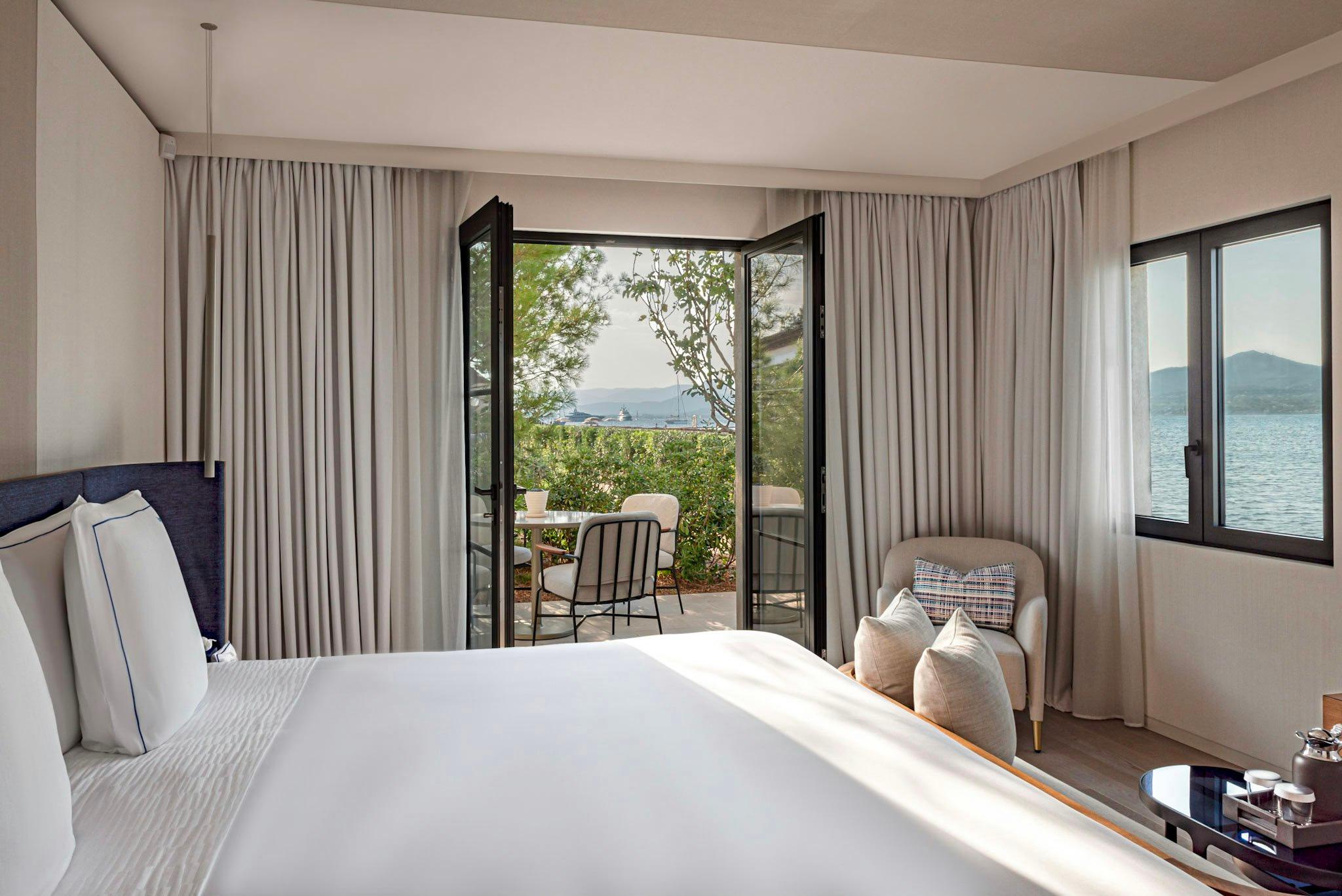 Cheval Blanc St-Tropez: bedroom with white bed and terrace opening to water views