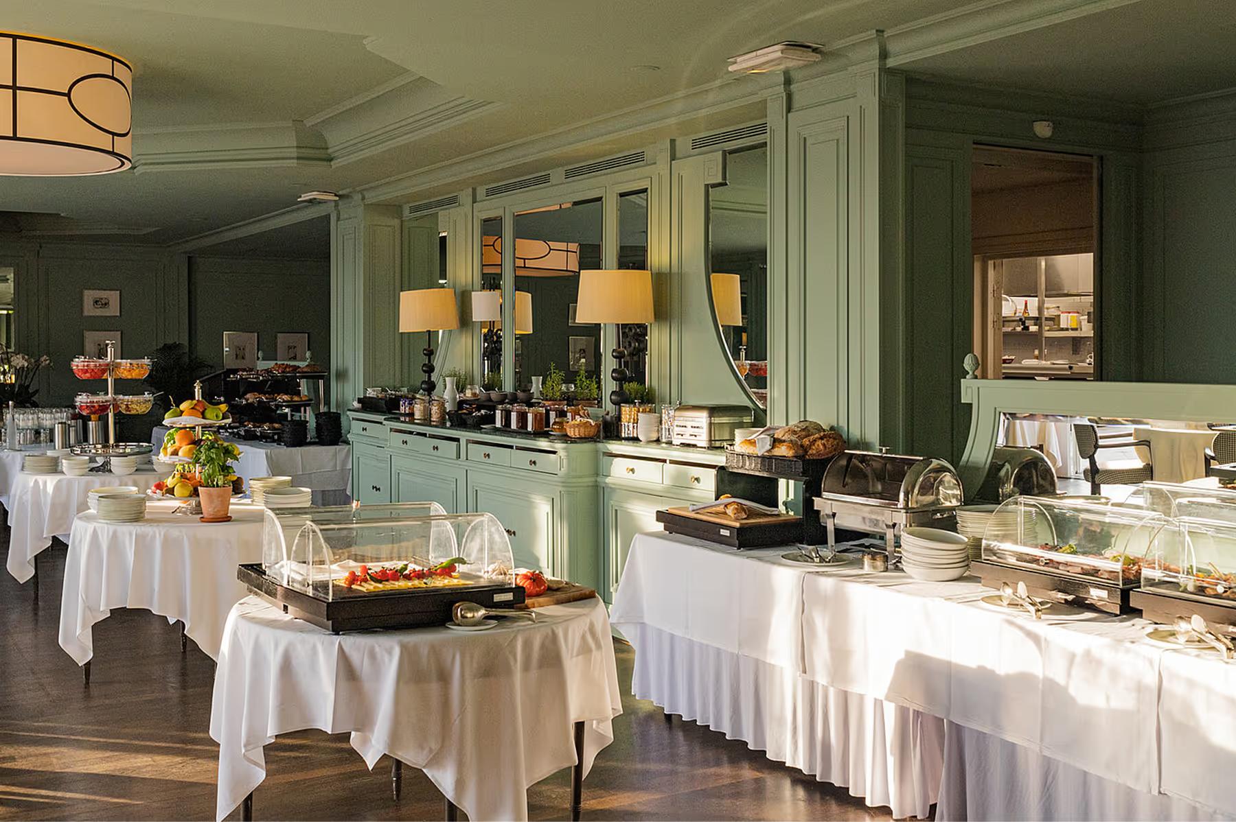 Althoff Villa Belrose: seafoam-green dining room with buffet service and table settings