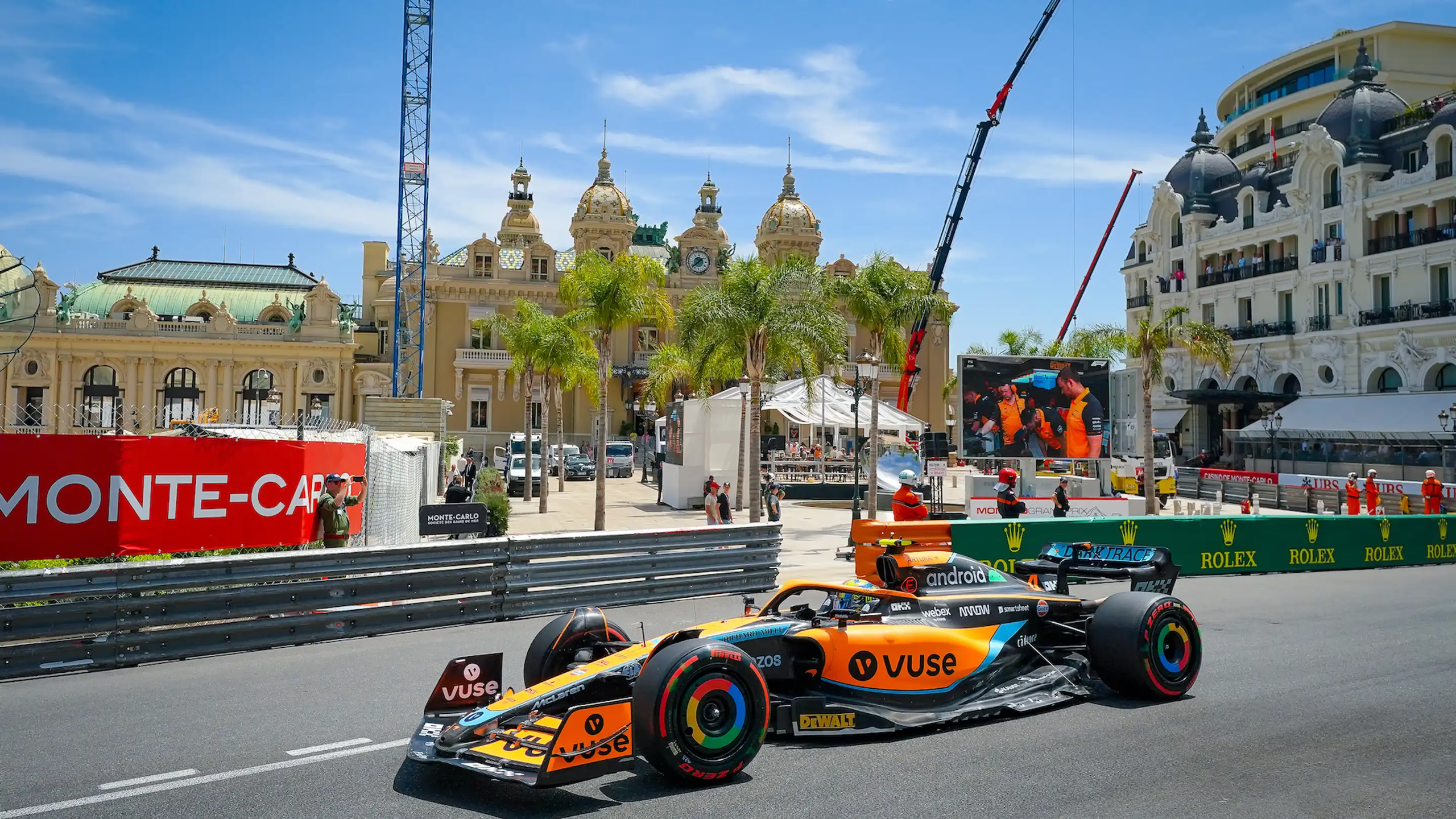 Formula 1 race car on Monaco street in front of historic palazzo