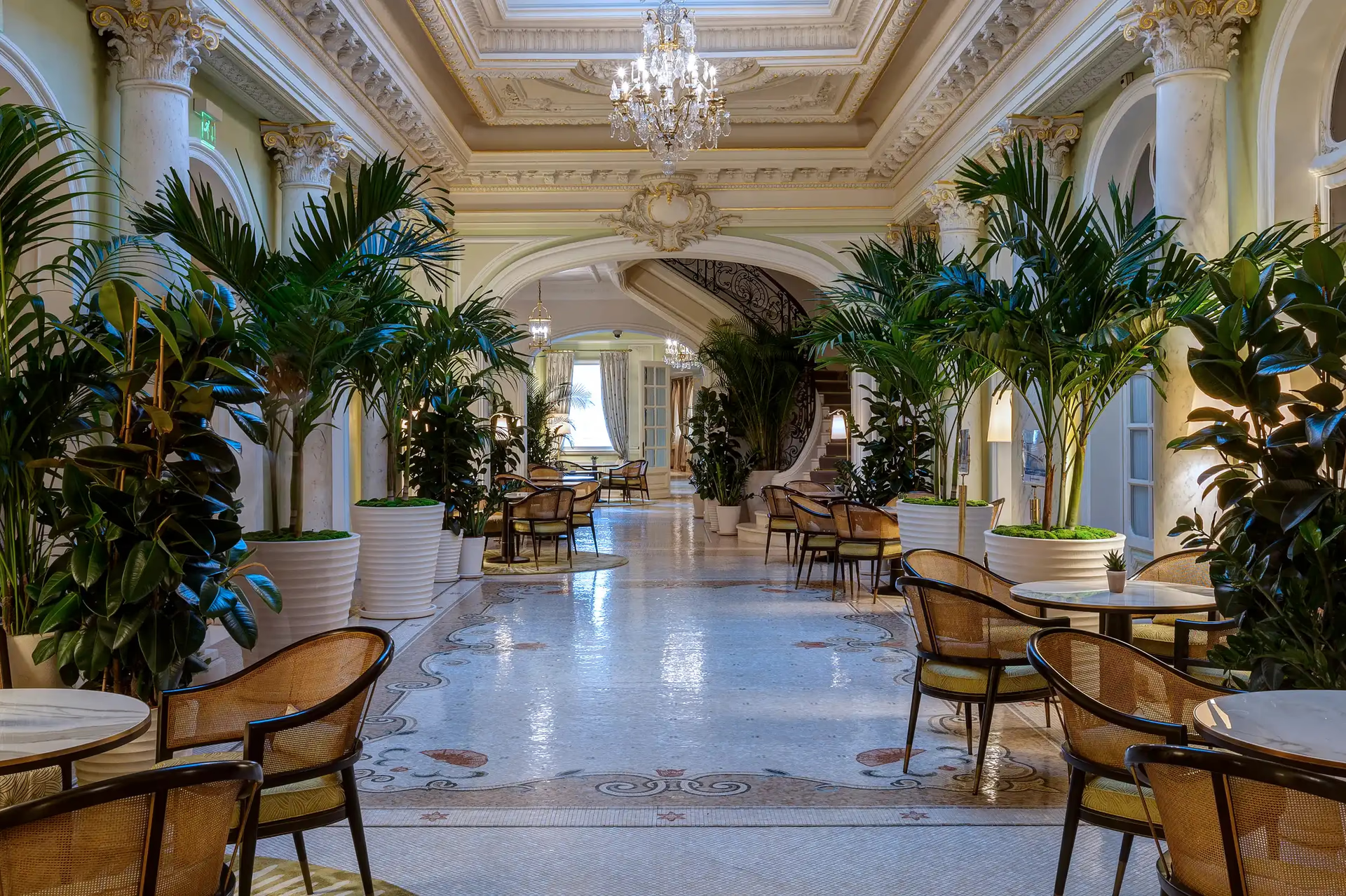 Hôtel Hermitage Monte-Carlo: grand hallway with coffered ceiling, crystal chandelier, palm trees and marble flooring