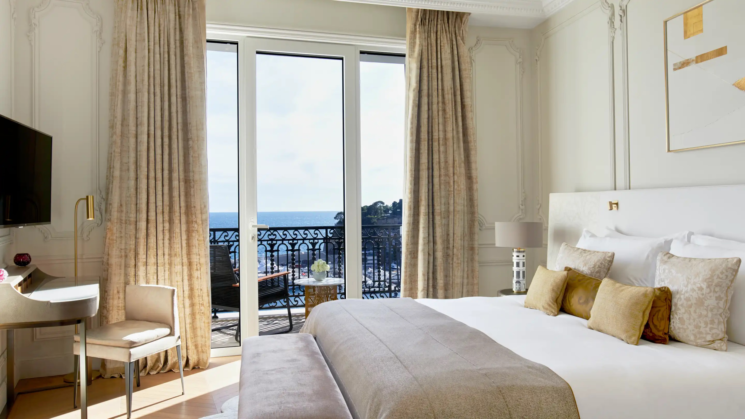 Hôtel de Paris Monte-Carlo: bedroom with bed facing open balcony with sea view, earth-tone furnishings