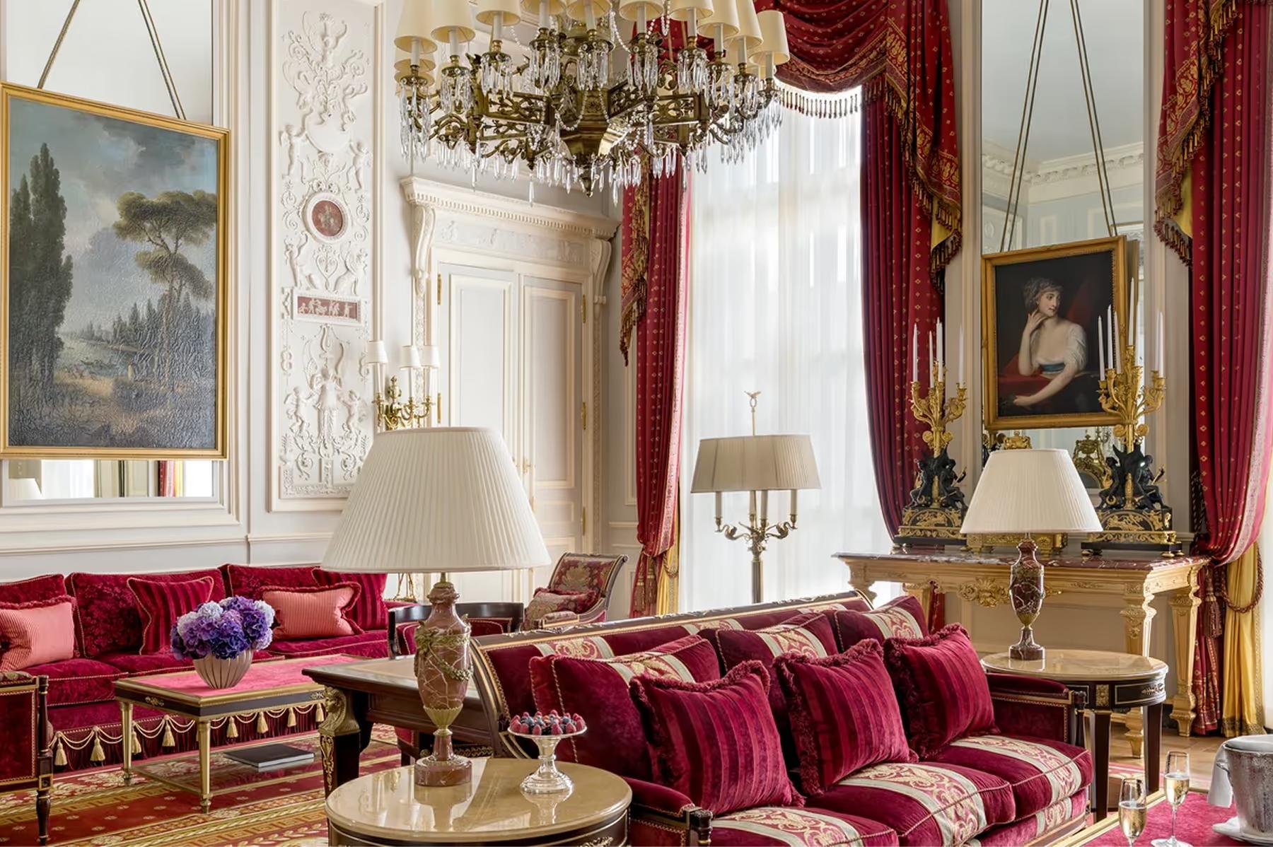 Ritz Paris: a salon with red velvet furnishings, gilt mirrors, and ornate ceiling moldings