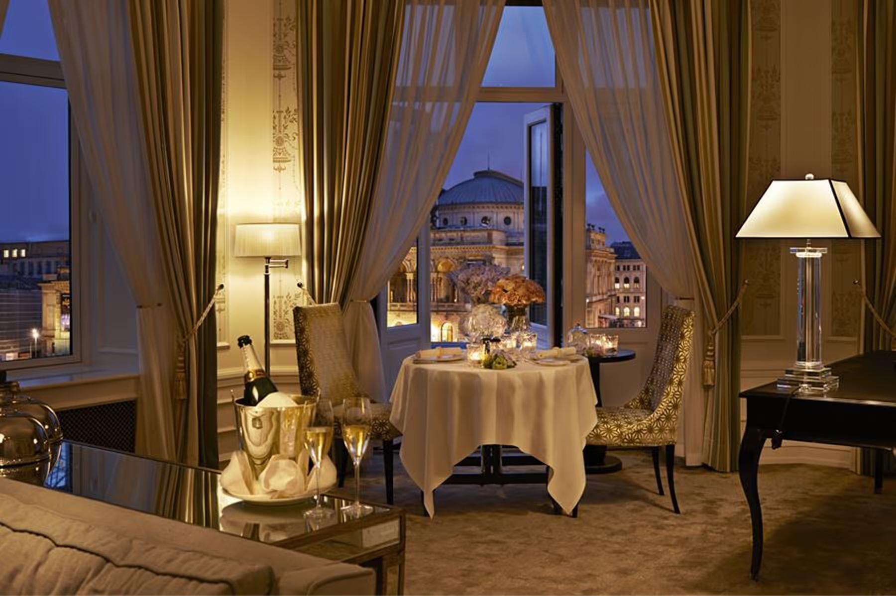 Hotel d’Angleterre: intimate dining room overlooking Copenhagen at dusk with curtained windows