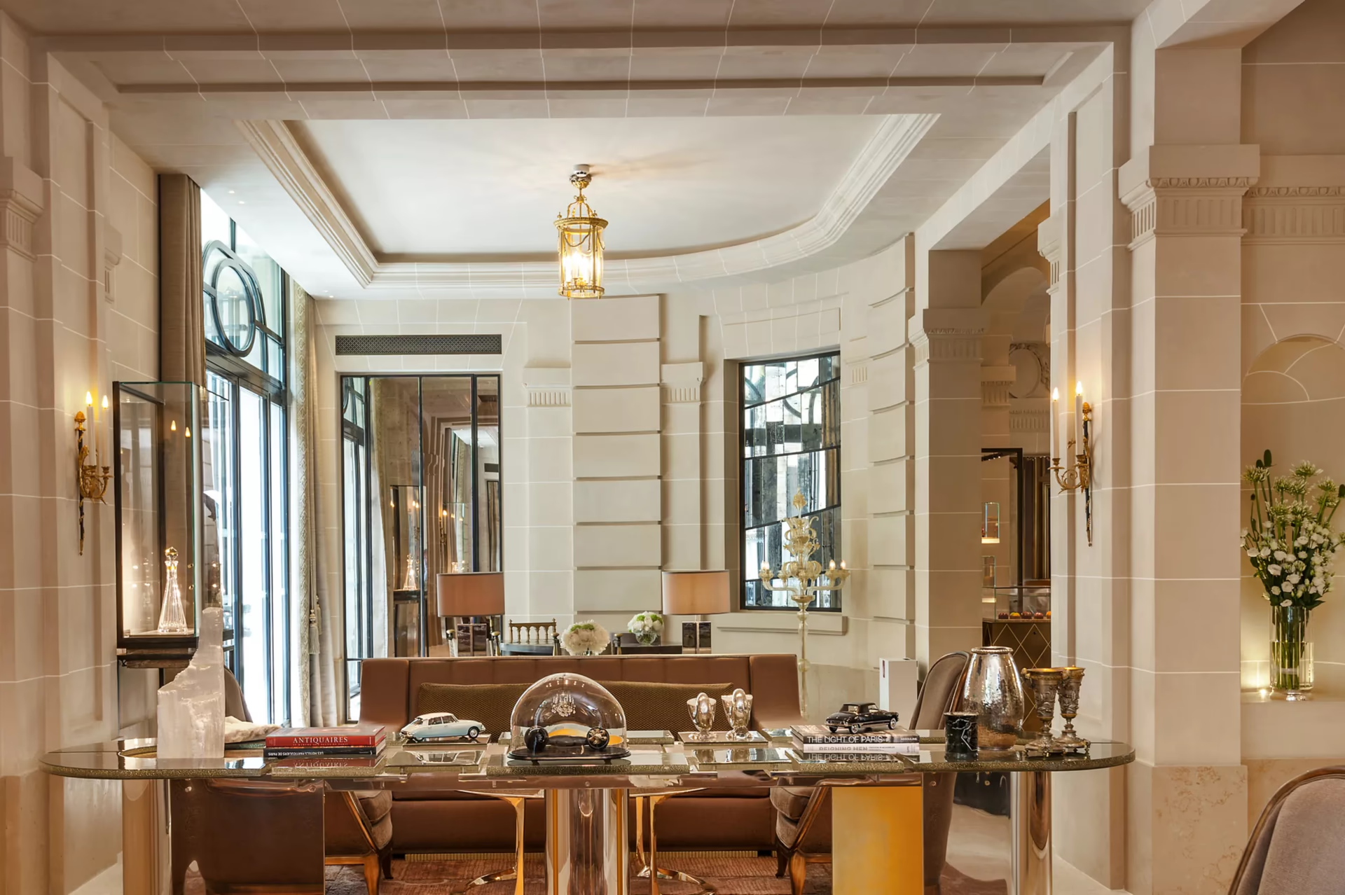 Elegant reception area with marble surfaces, gold accents, and classical proportions