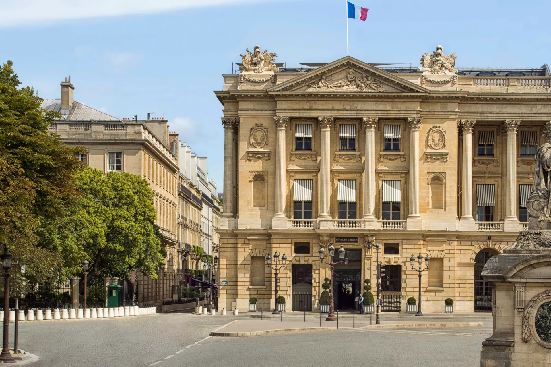 Hôtel de Crillon: grand 18th-century facade with classical columns and French flag, Place de la Concorde