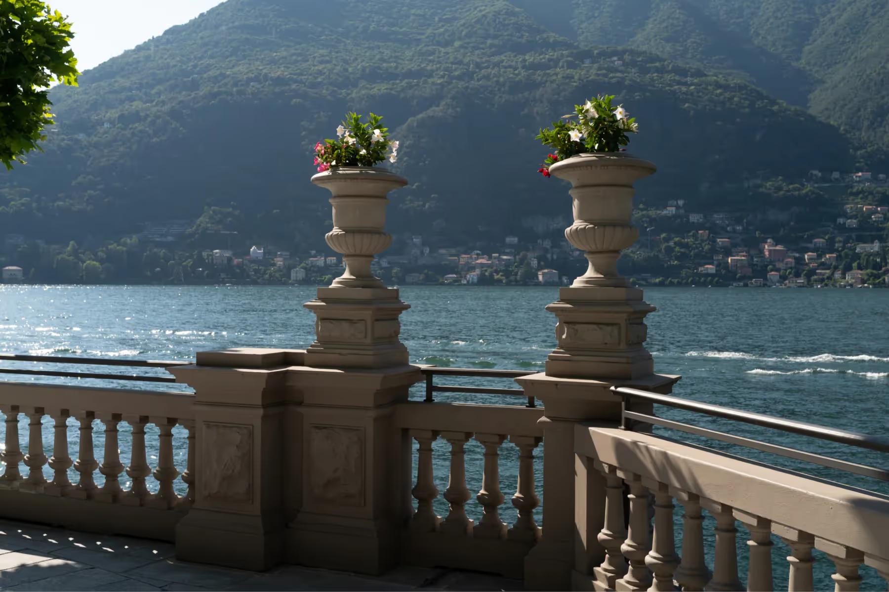 Mandarin Oriental, Lake Como: stone balustrade with classical urns overlooking turquoise lake and surrounding mountains