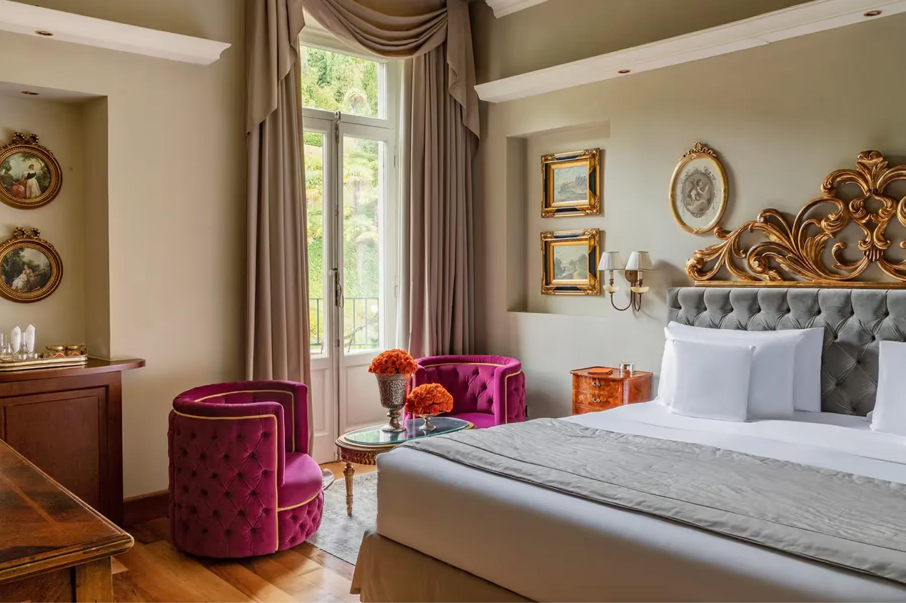 Grand Hotel Tremezzo: bedroom with burgundy armchair, taupe furnishings, and green window trim