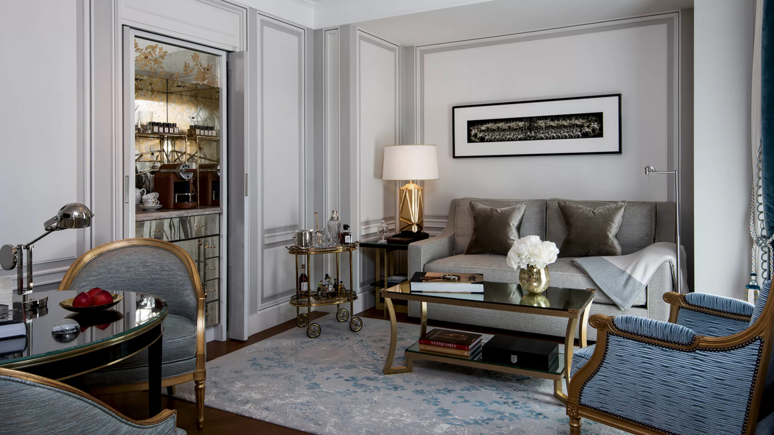 Hôtel de Crillon: bedroom with marble bathroom visible, ornamental mirrors, and soft neutral tones
