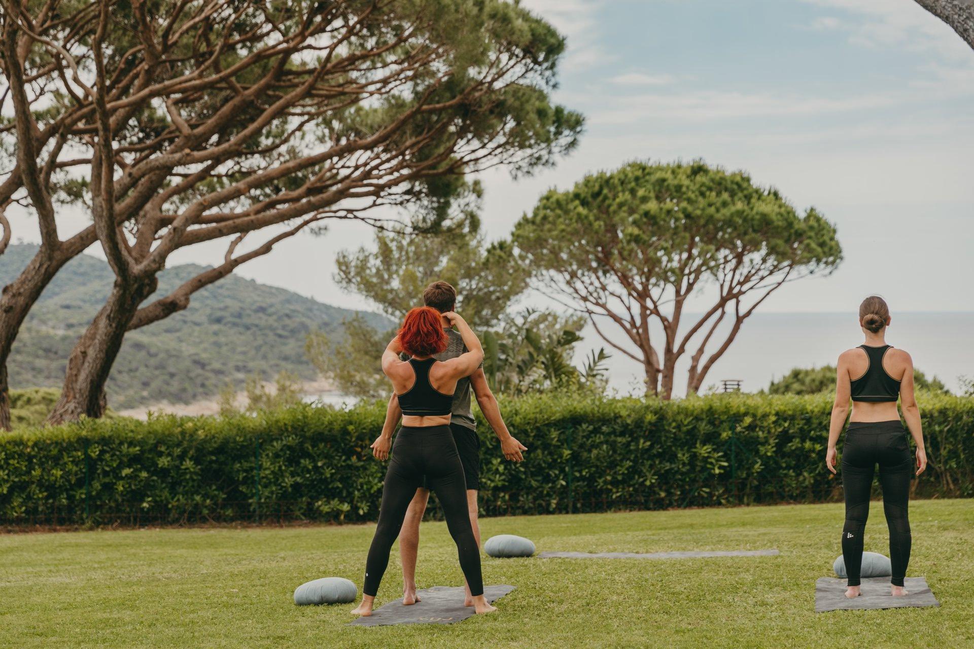 Lily of the Valley: outdoor fitness class on lawn with instructors and participants