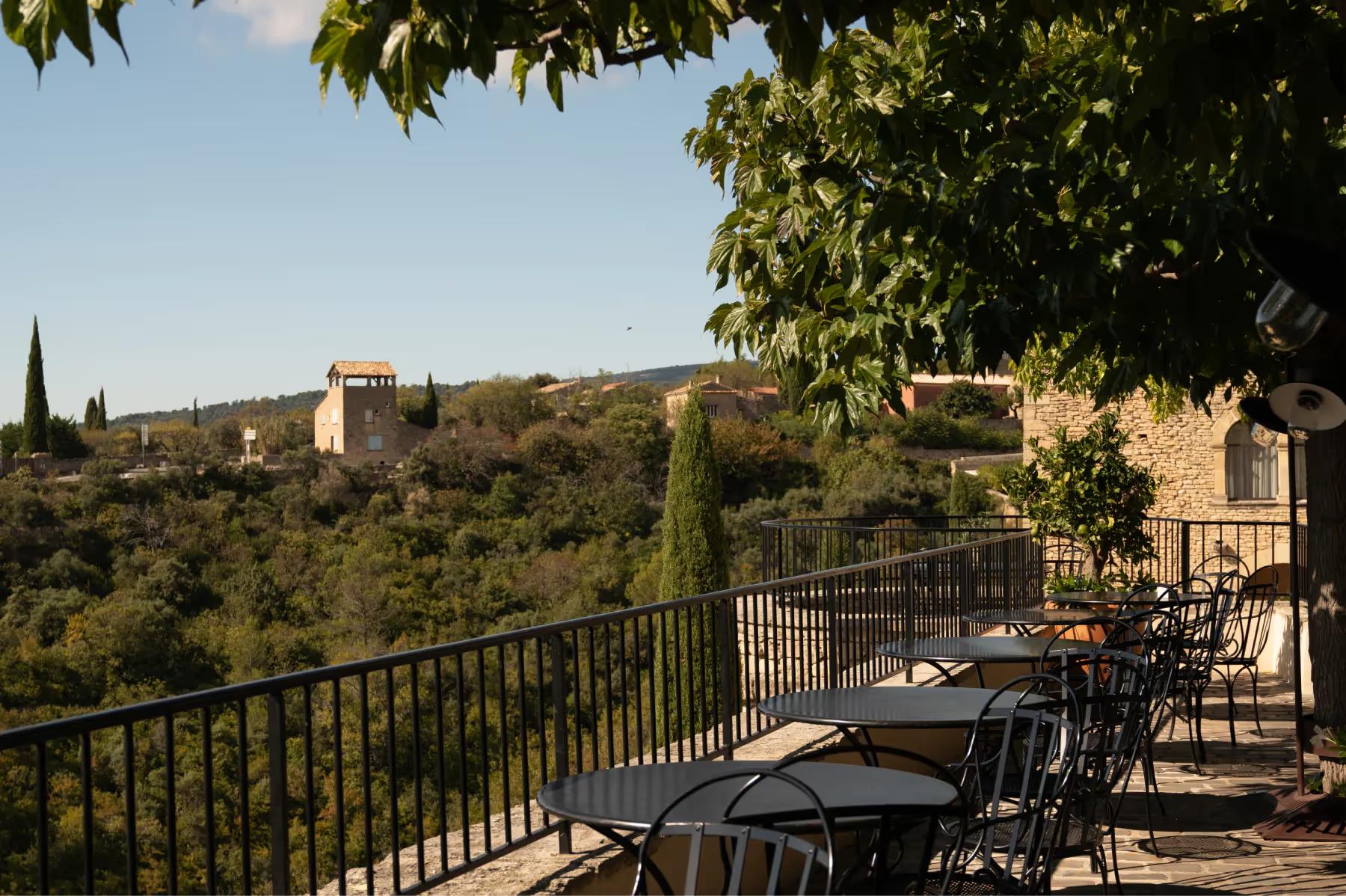 Airelles Gordes, La Bastide: dining terrace overlooking the Gordes landscape at golden hour