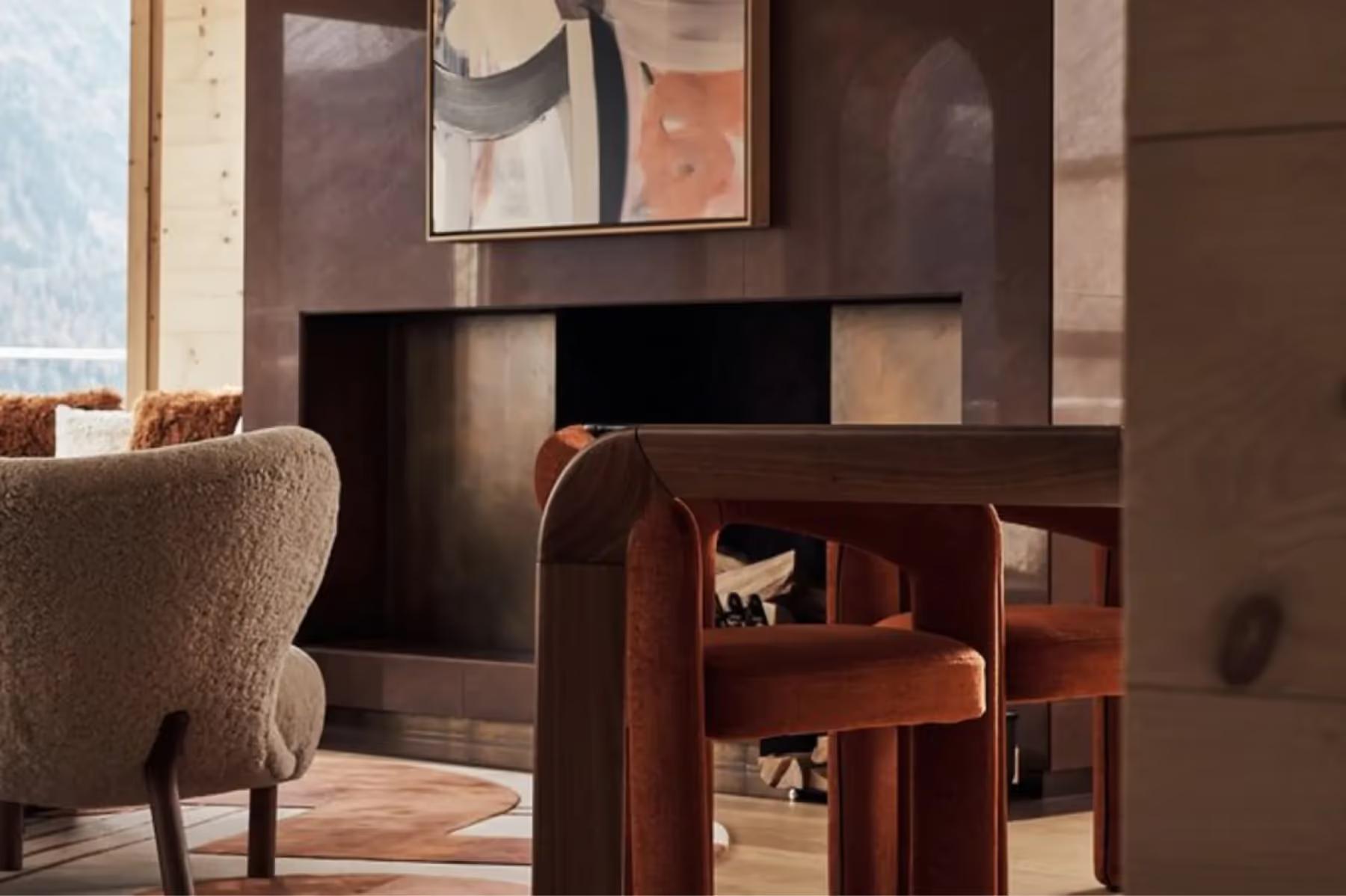 Kulm Hotel St. Moritz: a bedroom with a king bed and warm wood architectural details overlooking mountains