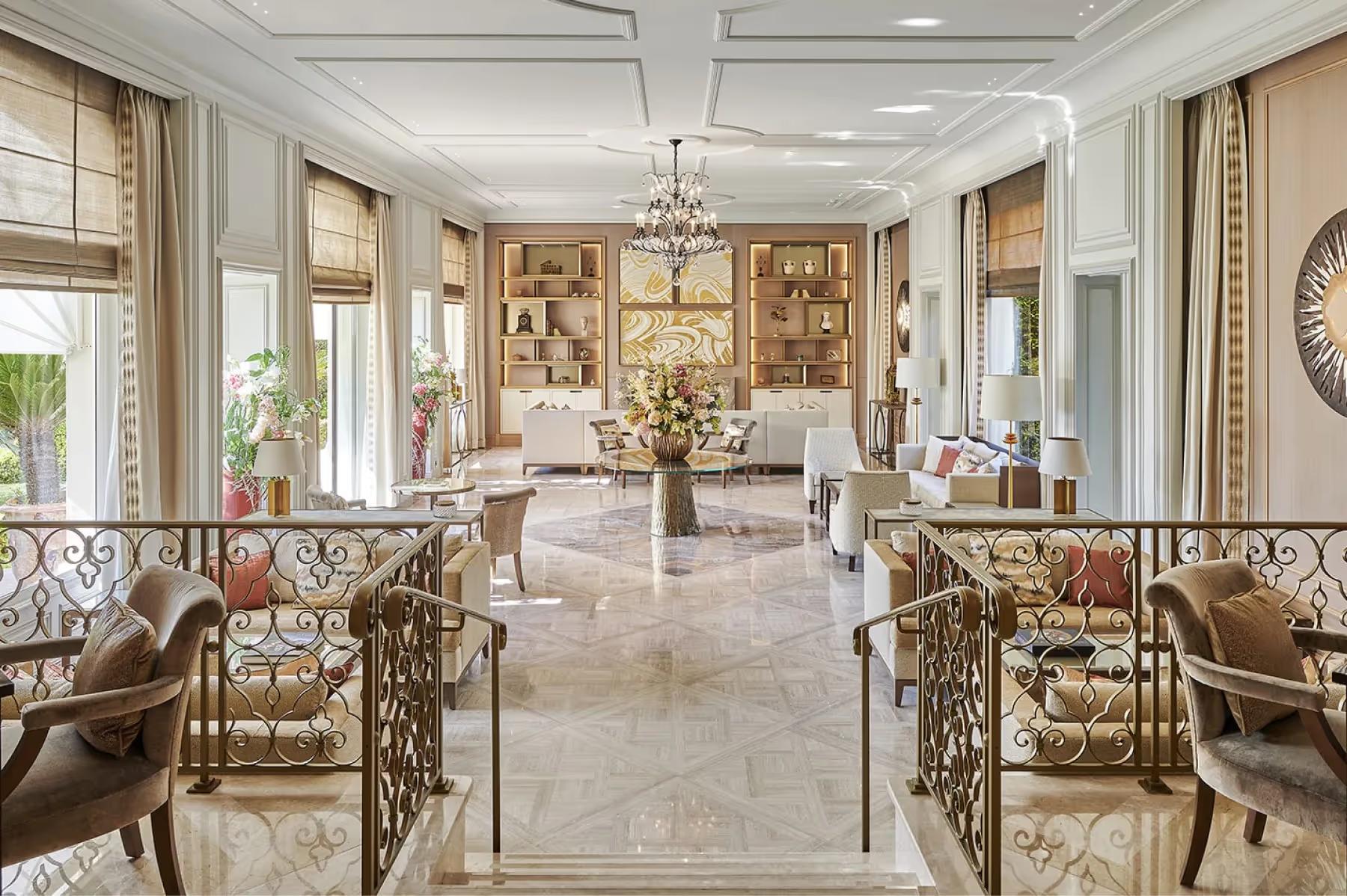 La Réserve de Beaulieu: elegant reception hall with classical fireplace and arched doorways