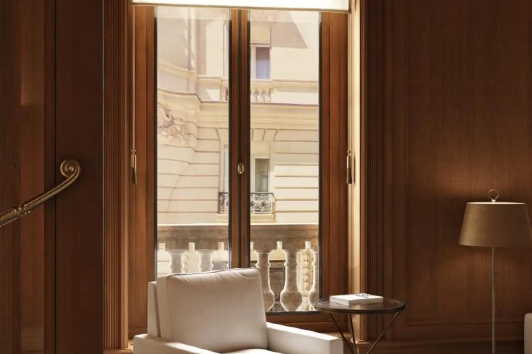 A spa room with warm wood tones, a bed, and modern fixtures
