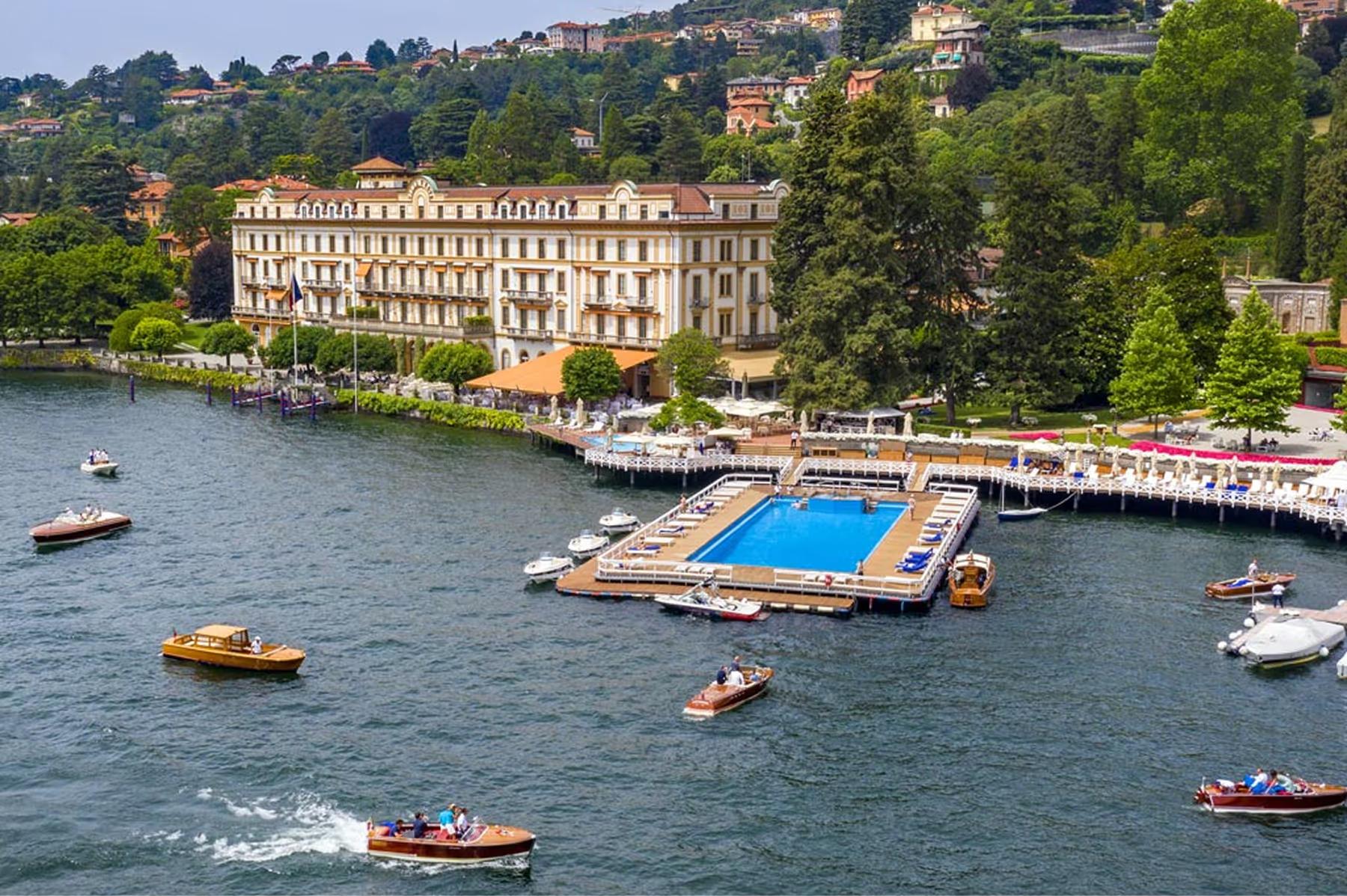 Waterfront view of the palazzo with surrounding lake and forested hillside
