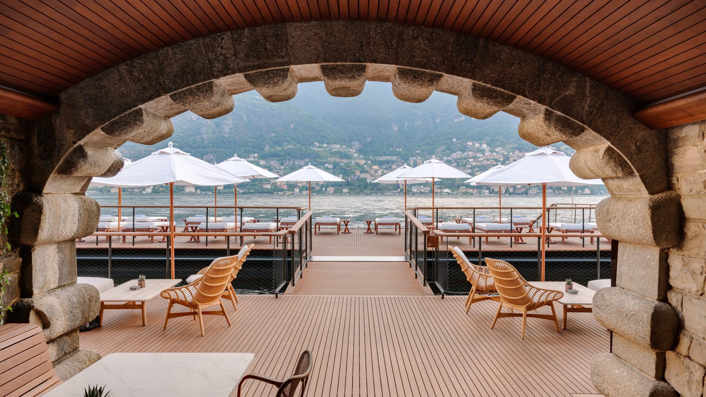 Mandarin Oriental, Lake Como: arched wooden ceiling dining space with tables facing open terrace and lake vistas