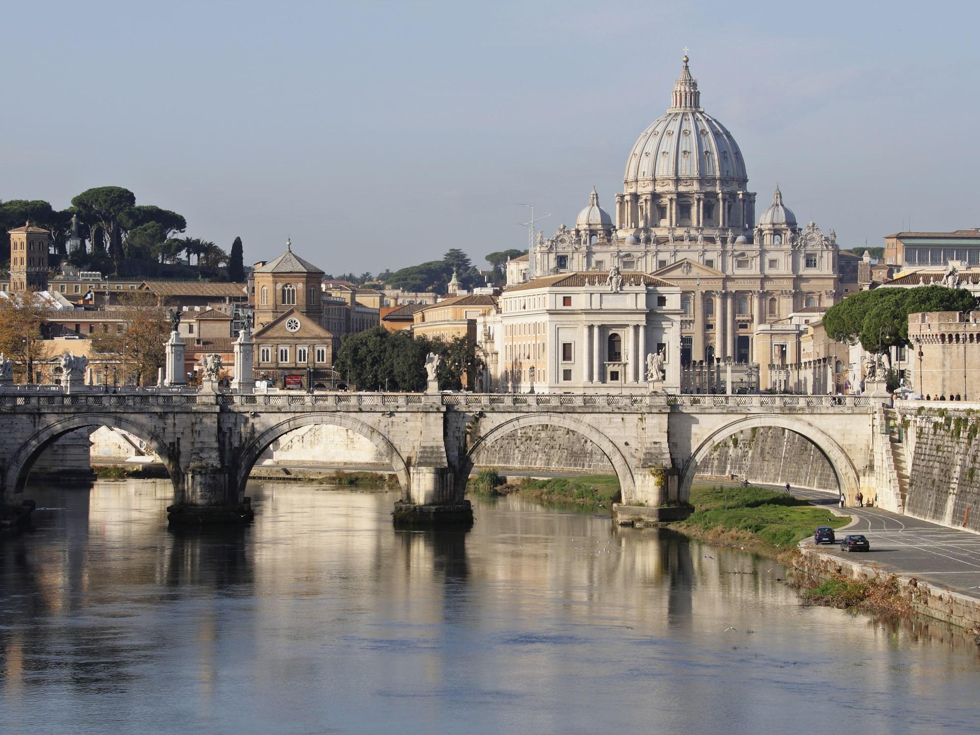 Hotel de Russie: St. Peter’s Basilica and Tiber bridges at dusk from across the water