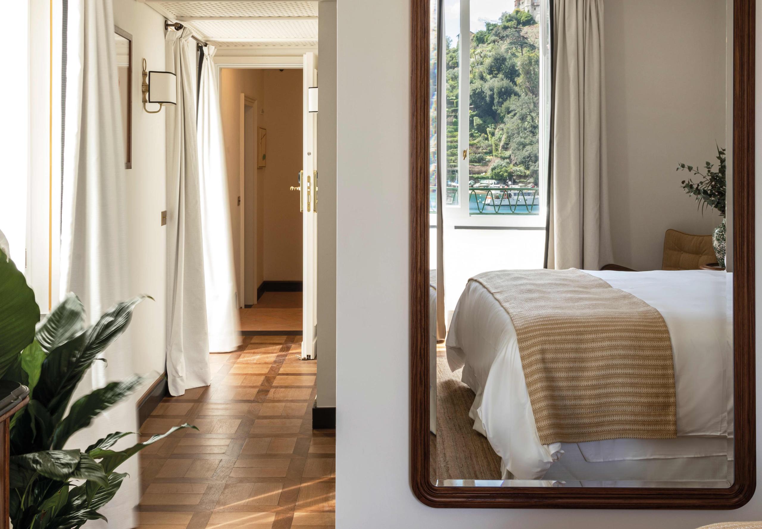 Hallway leading to guest room with modern wooden door