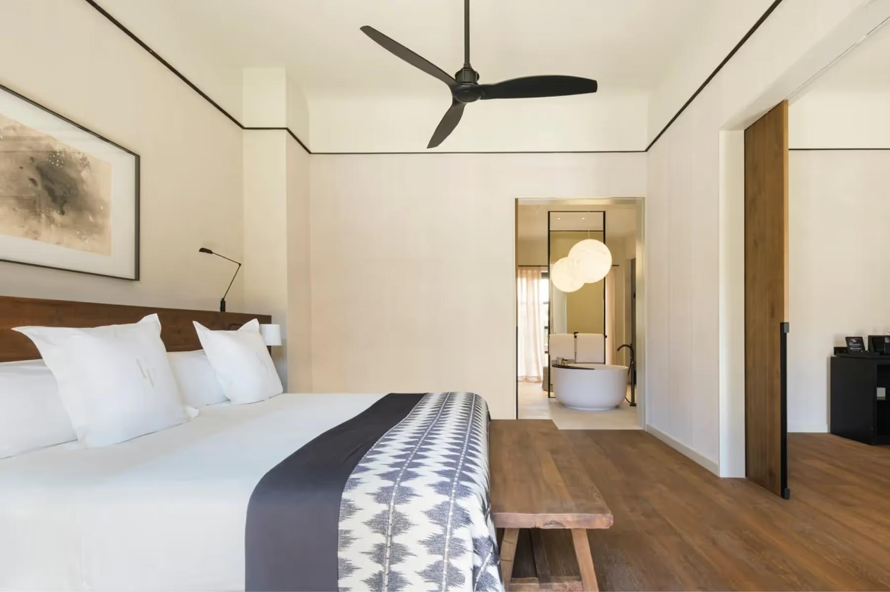 Guest room with contemporary design and neutral furnishings