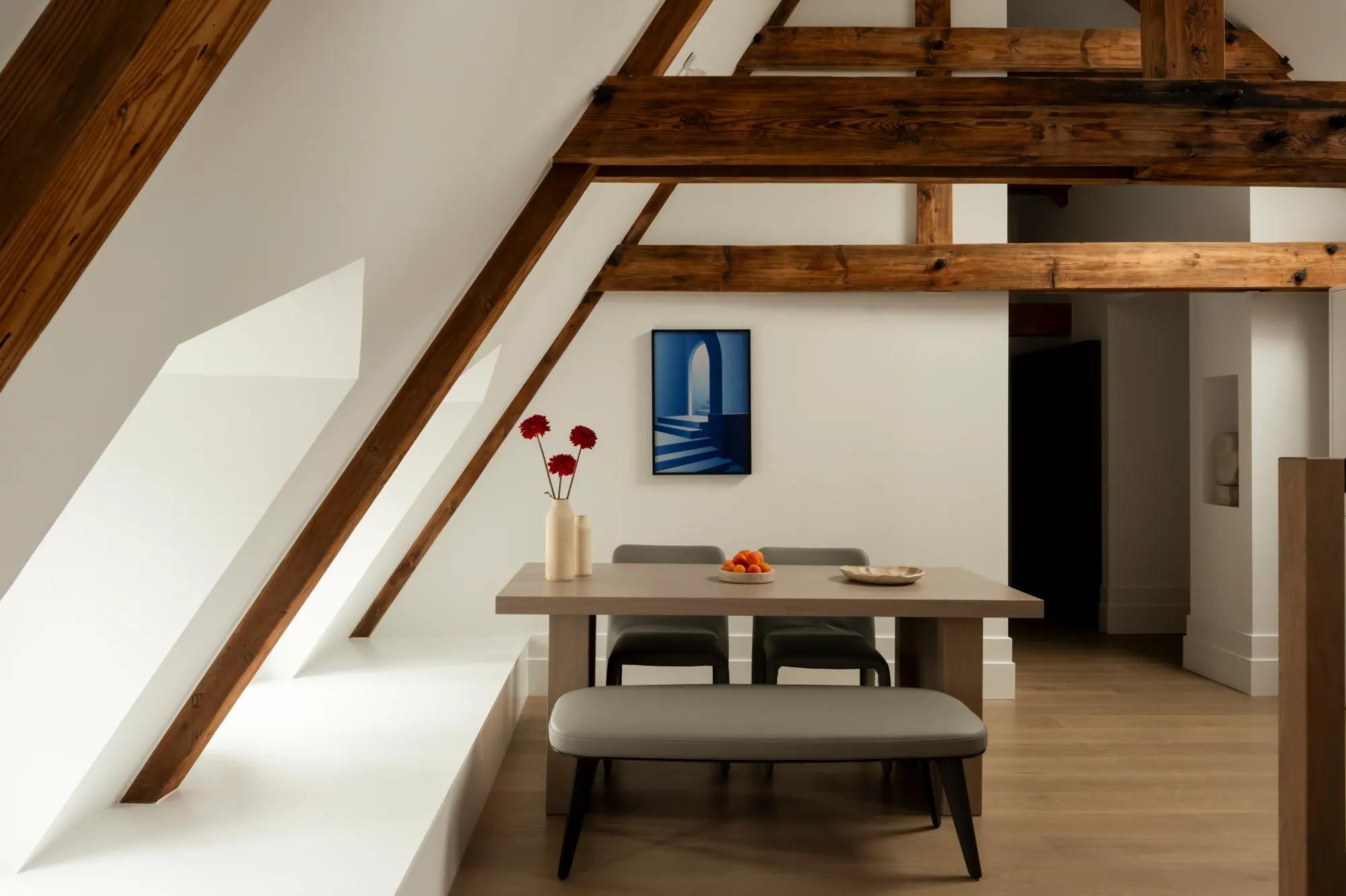 Rosewood Amsterdam: the Prinsengracht House dining area under old timber roof beams