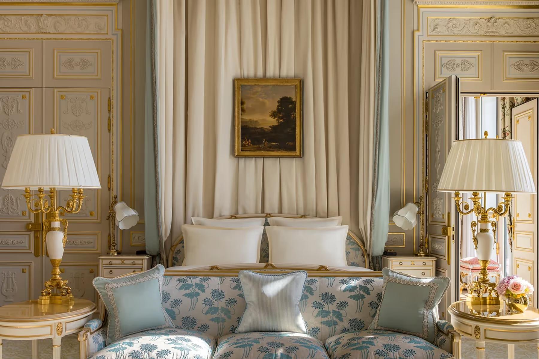 Ritz Paris: a cream suite with striped curtains, gilt ceiling details, and upholstered seating arrangement