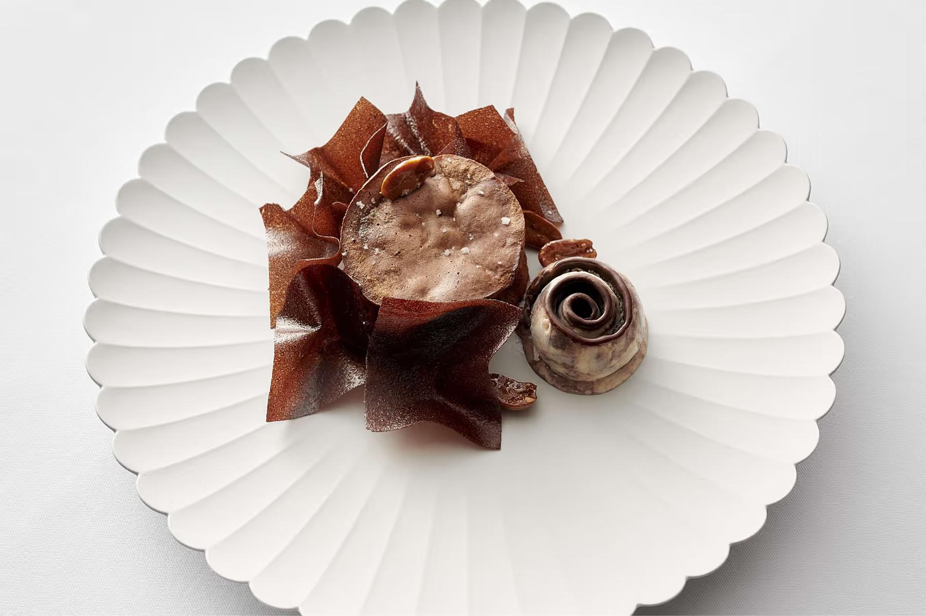 Royal Champagne Hotel & Spa: single plated course on white porcelain with garnish and sauce arrangement
