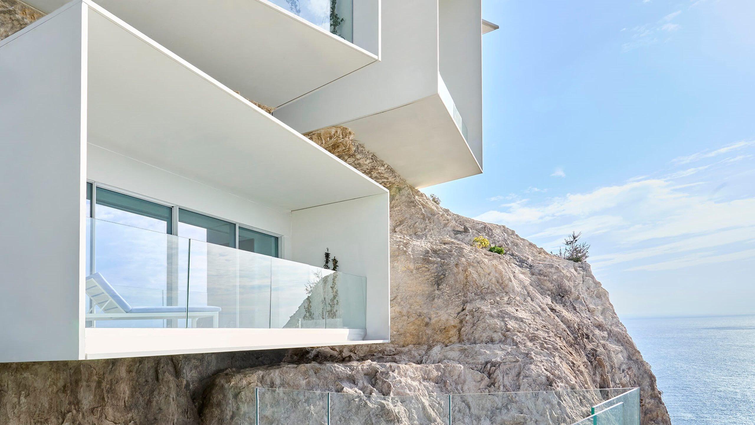 Maybourne Riviera: modern architecture cantilevered over a rocky outcrop