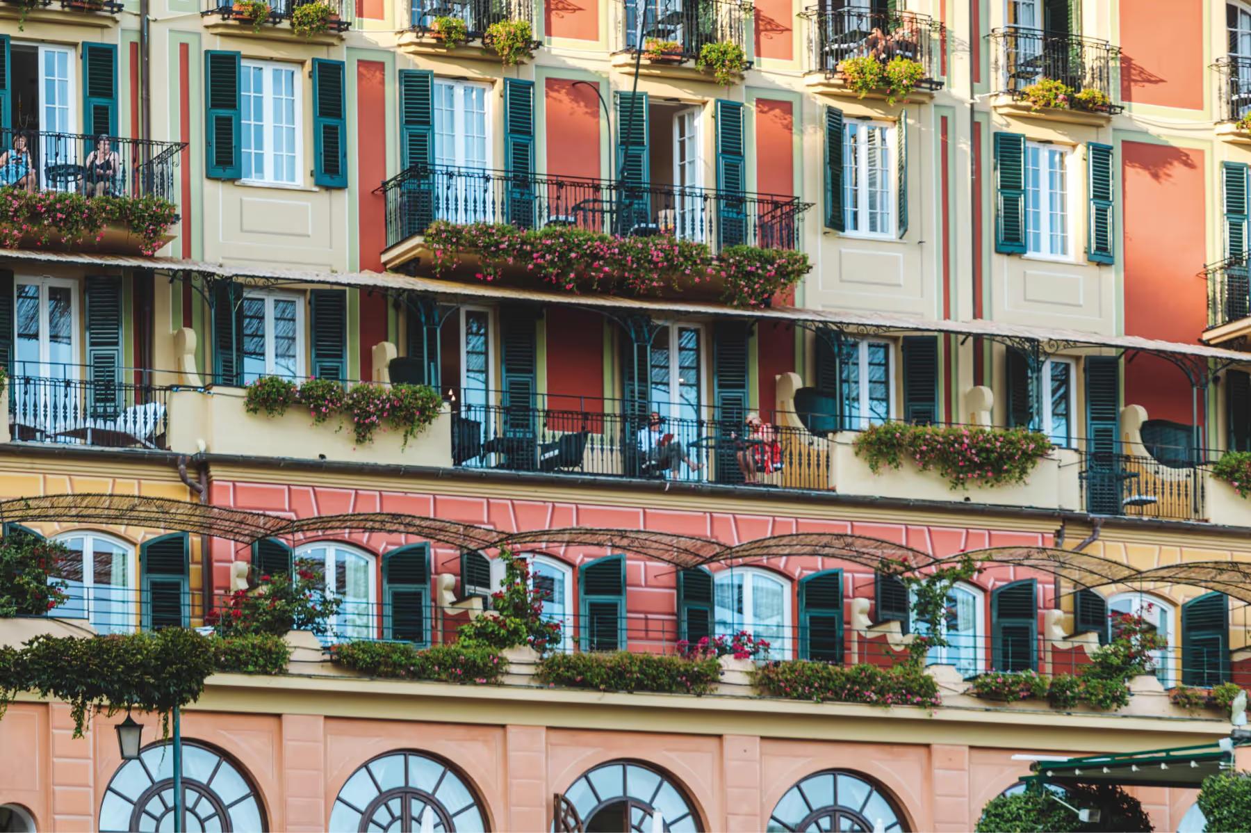 Splendido: colorful traditional buildings with shutters reflecting the coastal village architecture