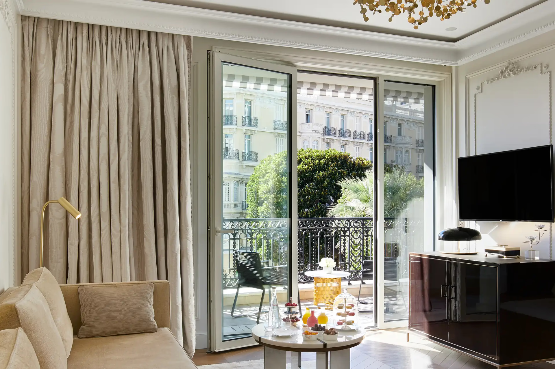 Hôtel de Paris Monte-Carlo: suite living room with glass doors opening to Monaco balcony and palace views