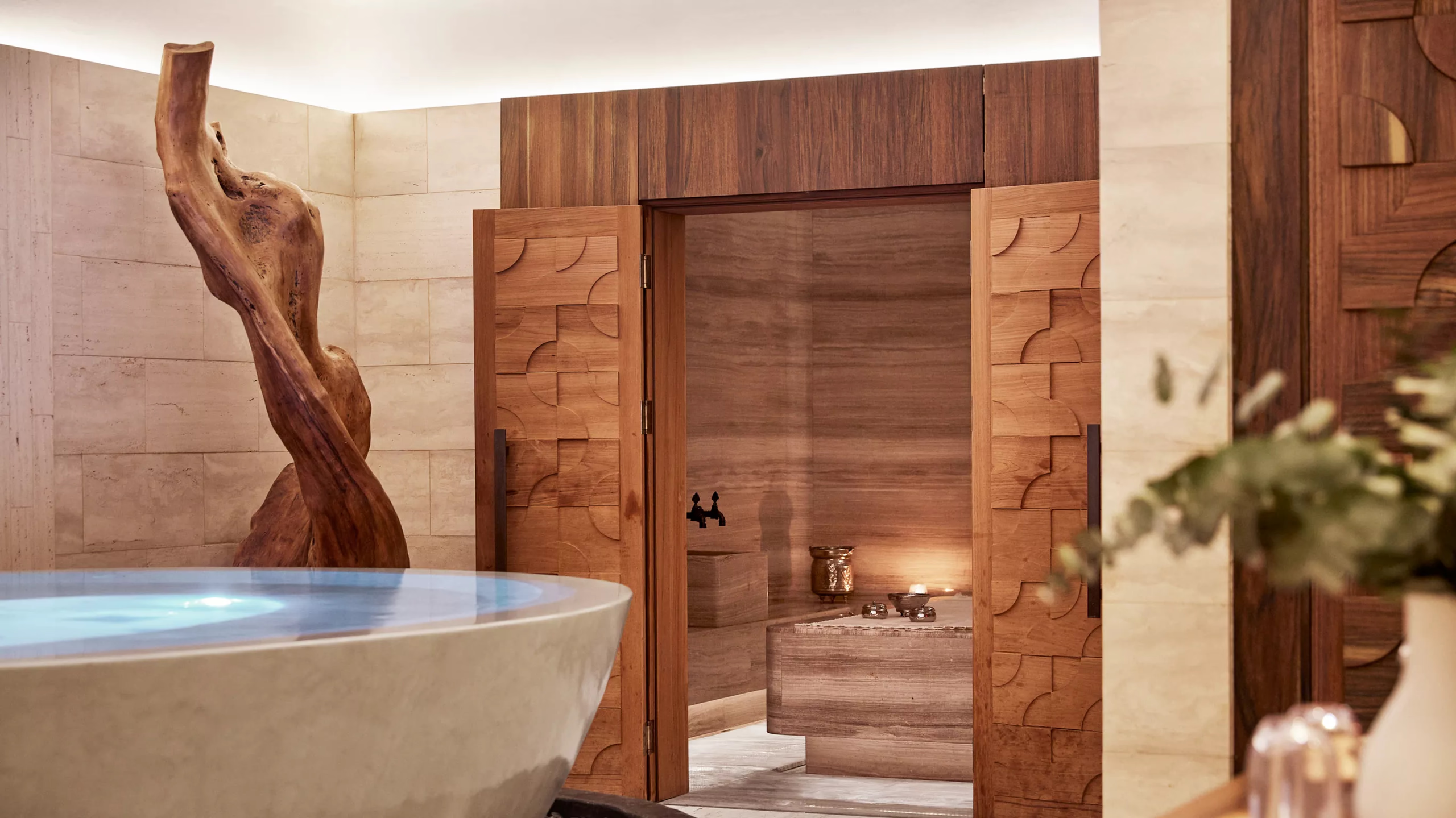 Rosewood Villa Magna: a spa with soaking tub, wooden steam room, and sculptural wooden element