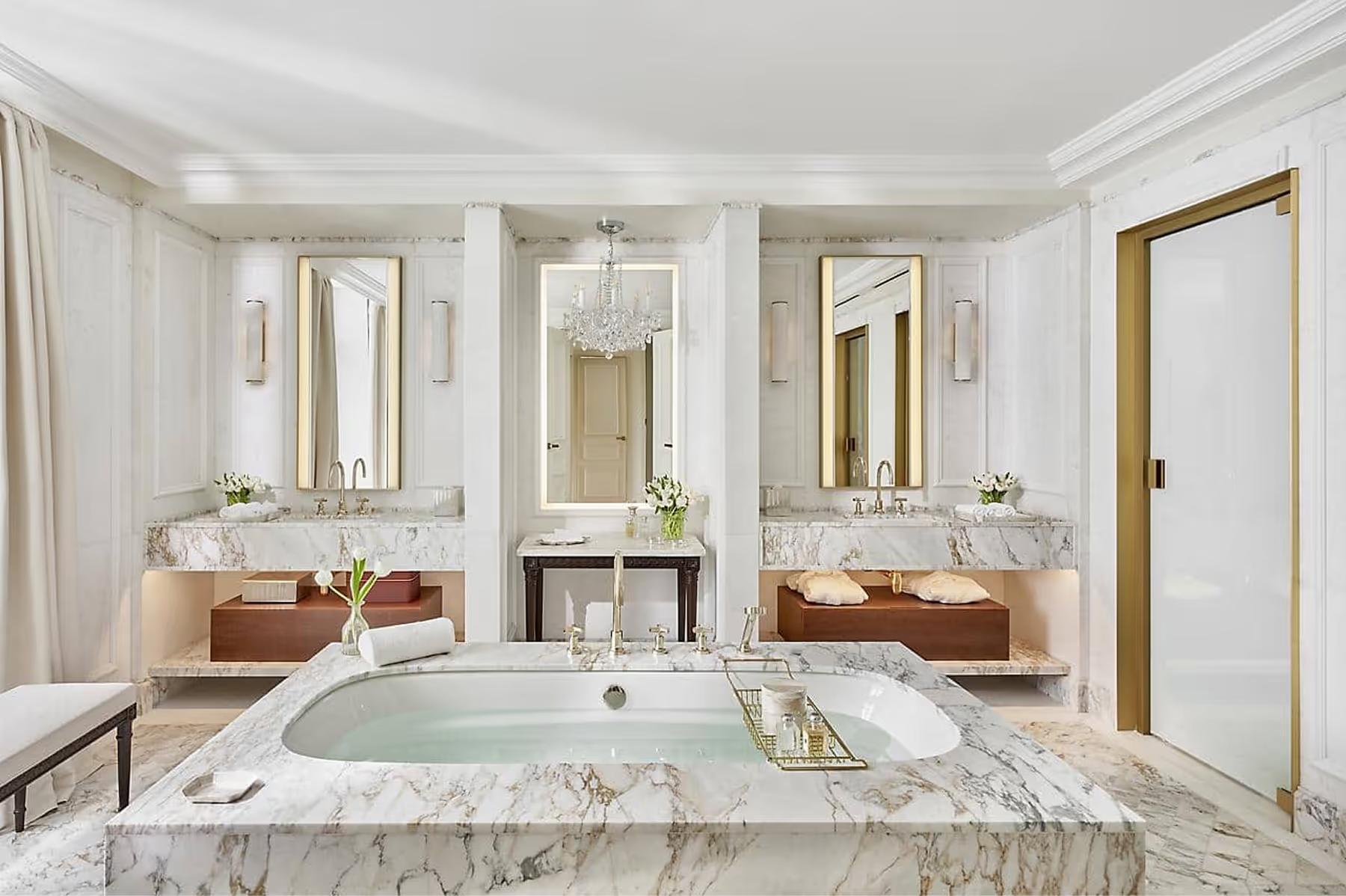 Mandarin Oriental Ritz, Madrid: spa bathroom with marble vanity, freestanding tub, and jewel-toned accents