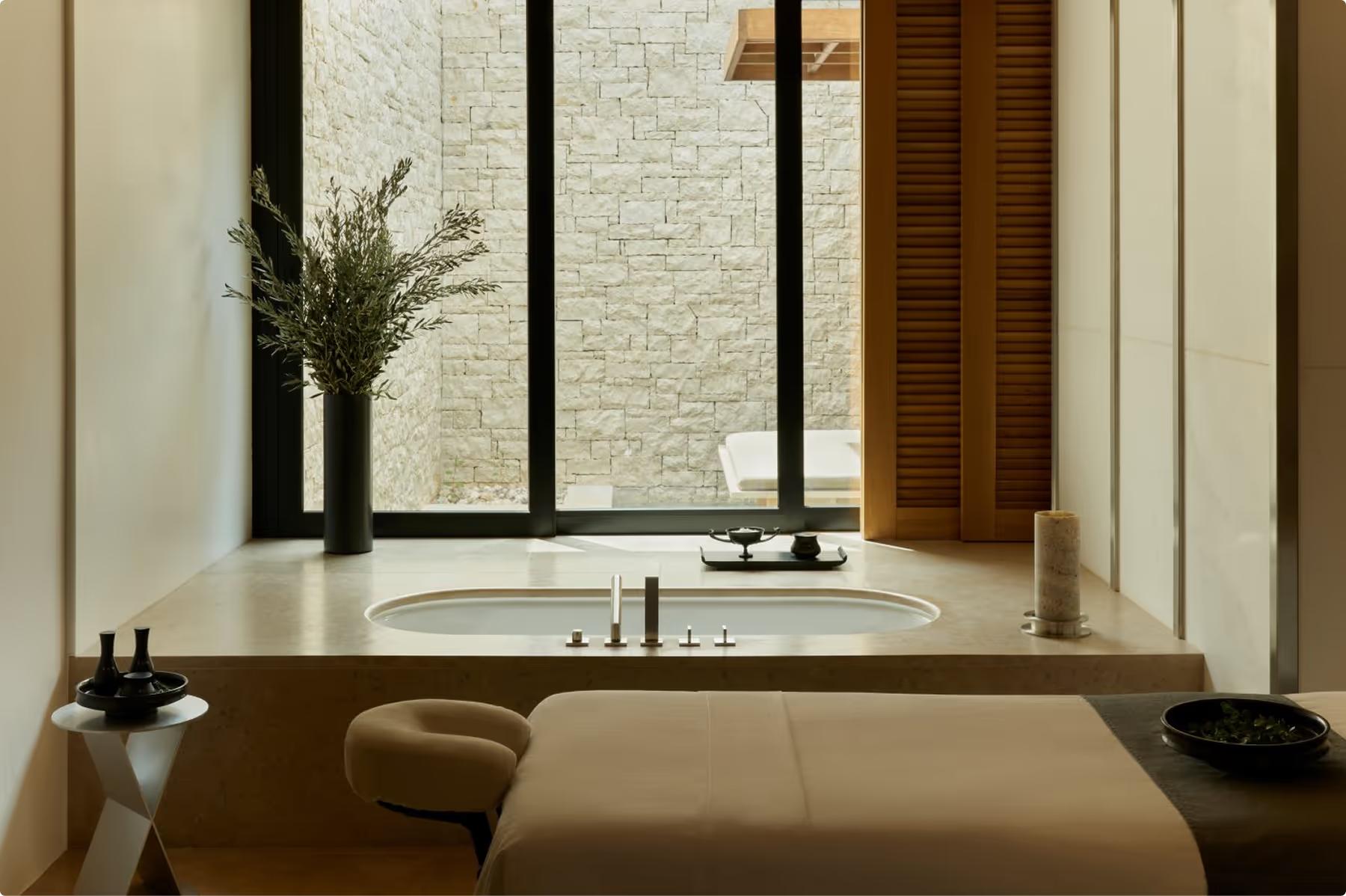 Amanzoe: spa bathroom with soaking tub and bright window opening