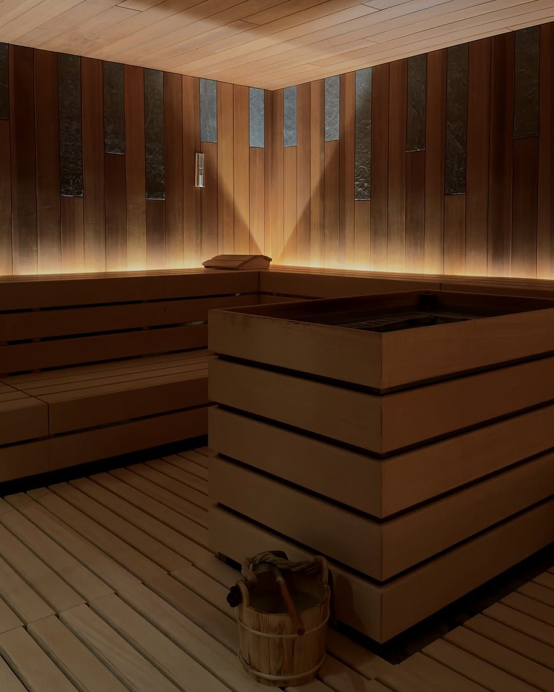 A warmly lit timber sauna at The Chedi Andermatt