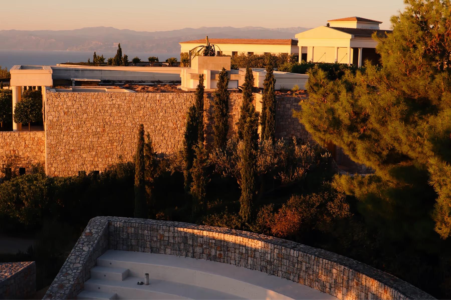 Waterfront pavilion at golden hour with Aegean seascape