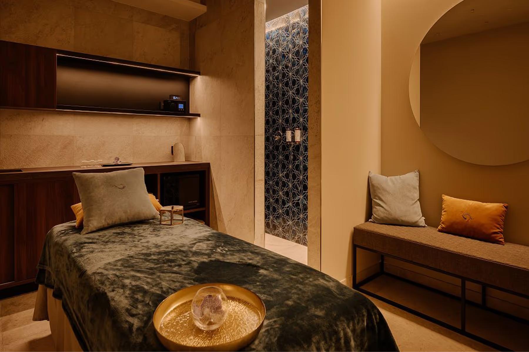 Grand Hotel Victoria Concept & Spa: a lounge with warm lighting, sculptural furniture, and dark wood surfaces