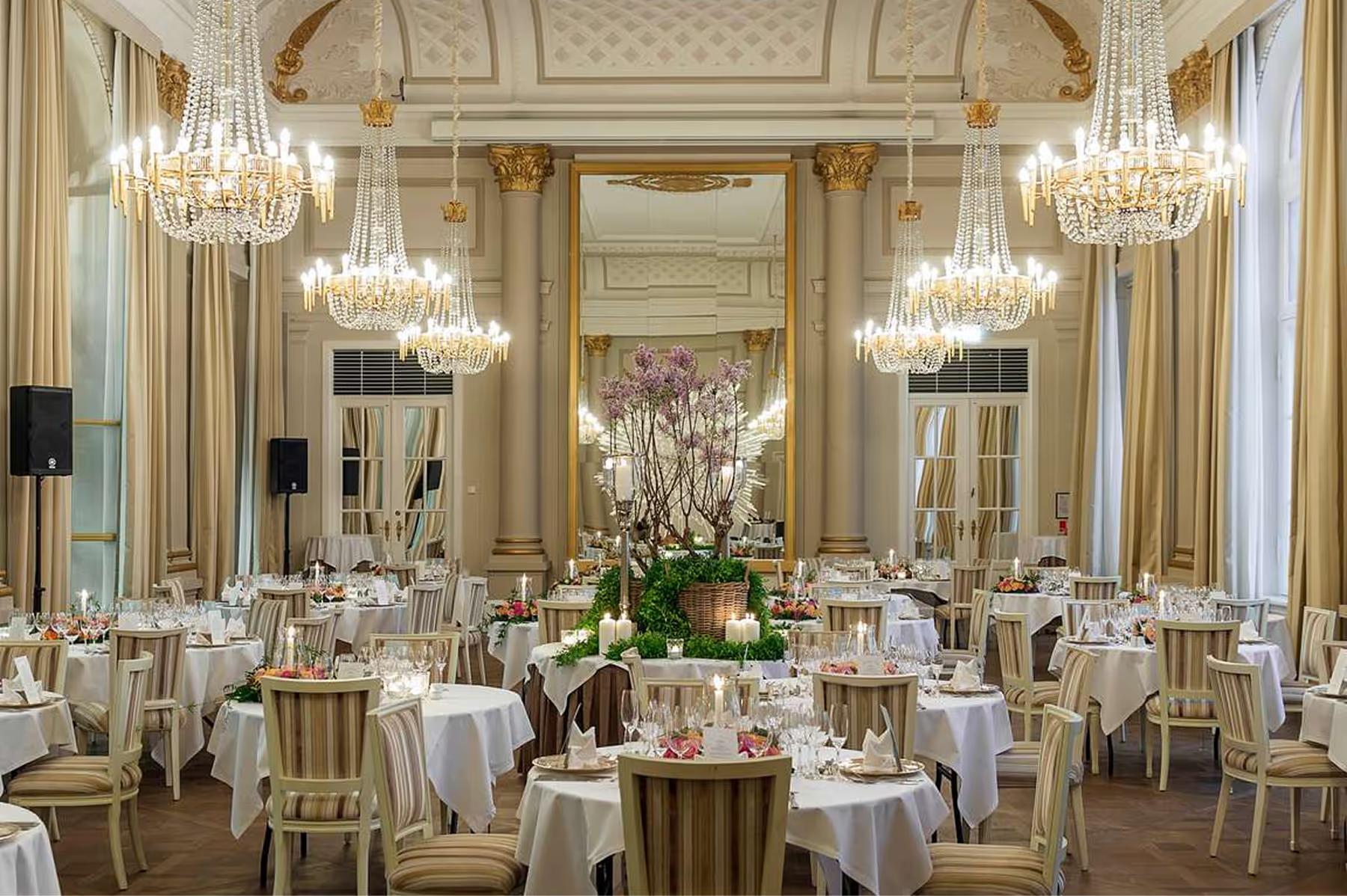 Grand ballroom with crystal chandeliers and neoclassical details