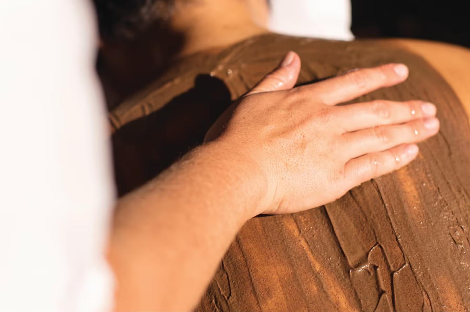 Villa San Michele: hands demonstrating massage technique on a client’s arm during spa treatment