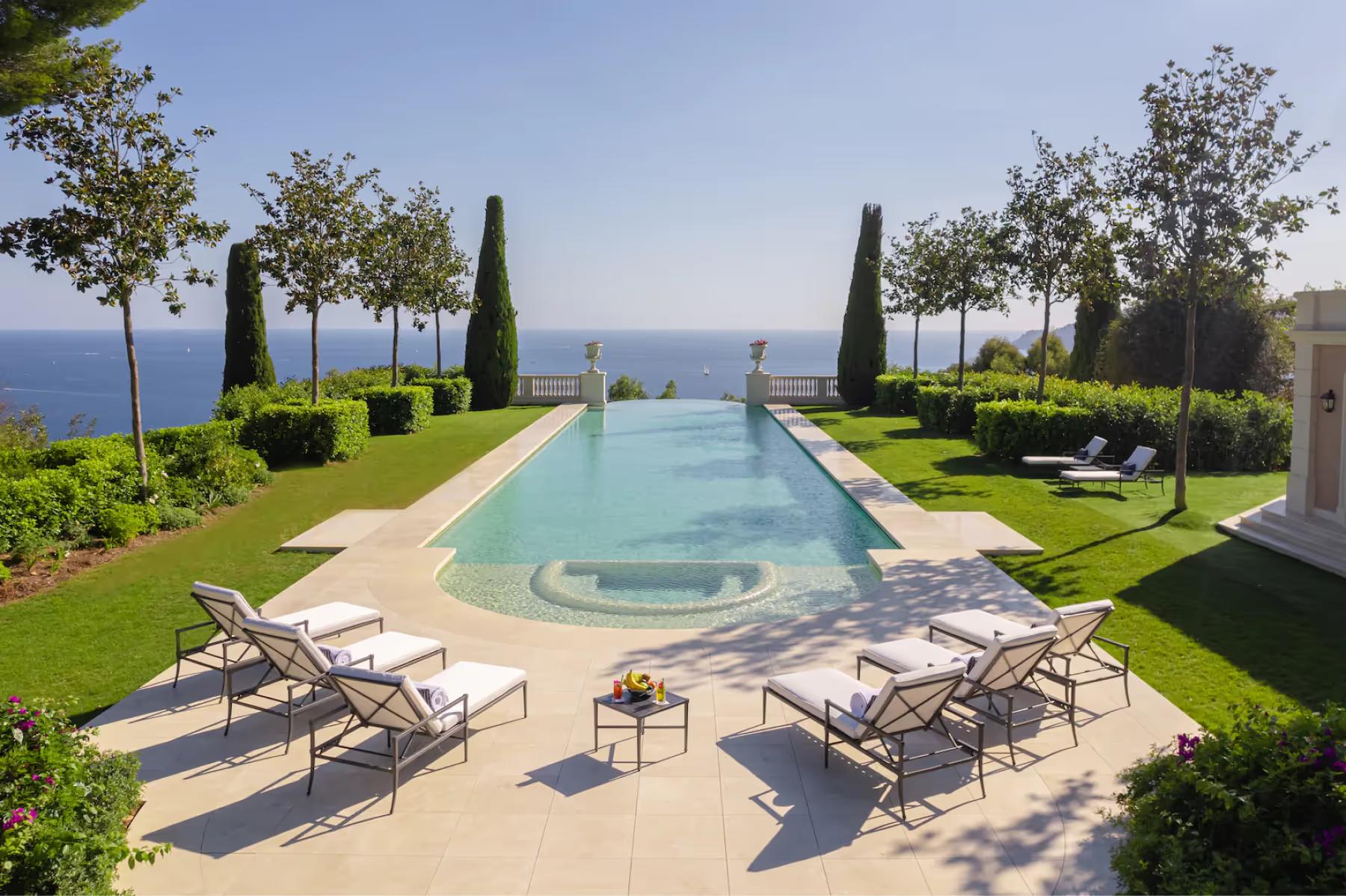 Le Château de La Croix des Gardes: stone balustrade terrace with sea views, cypress alleys, and manicured garden beds