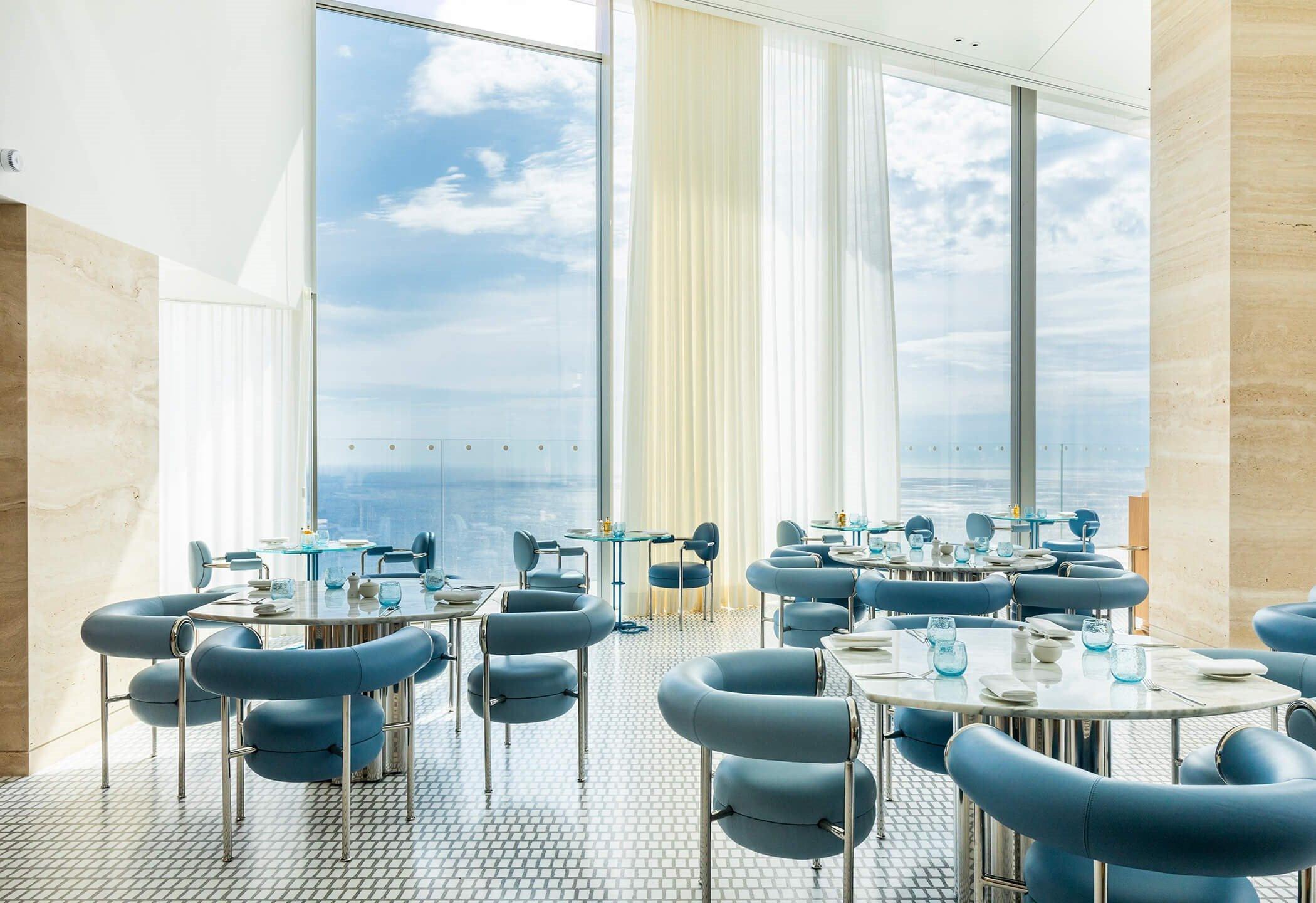 Maybourne Riviera: fine dining restaurant with blue seating and Mediterranean vistas