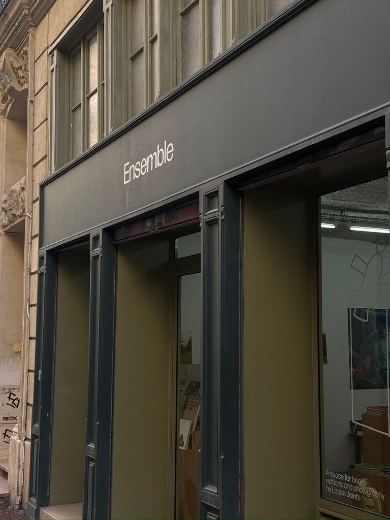 The dark green storefront of Ensemble, a shop for books, editions and photography in Marseille