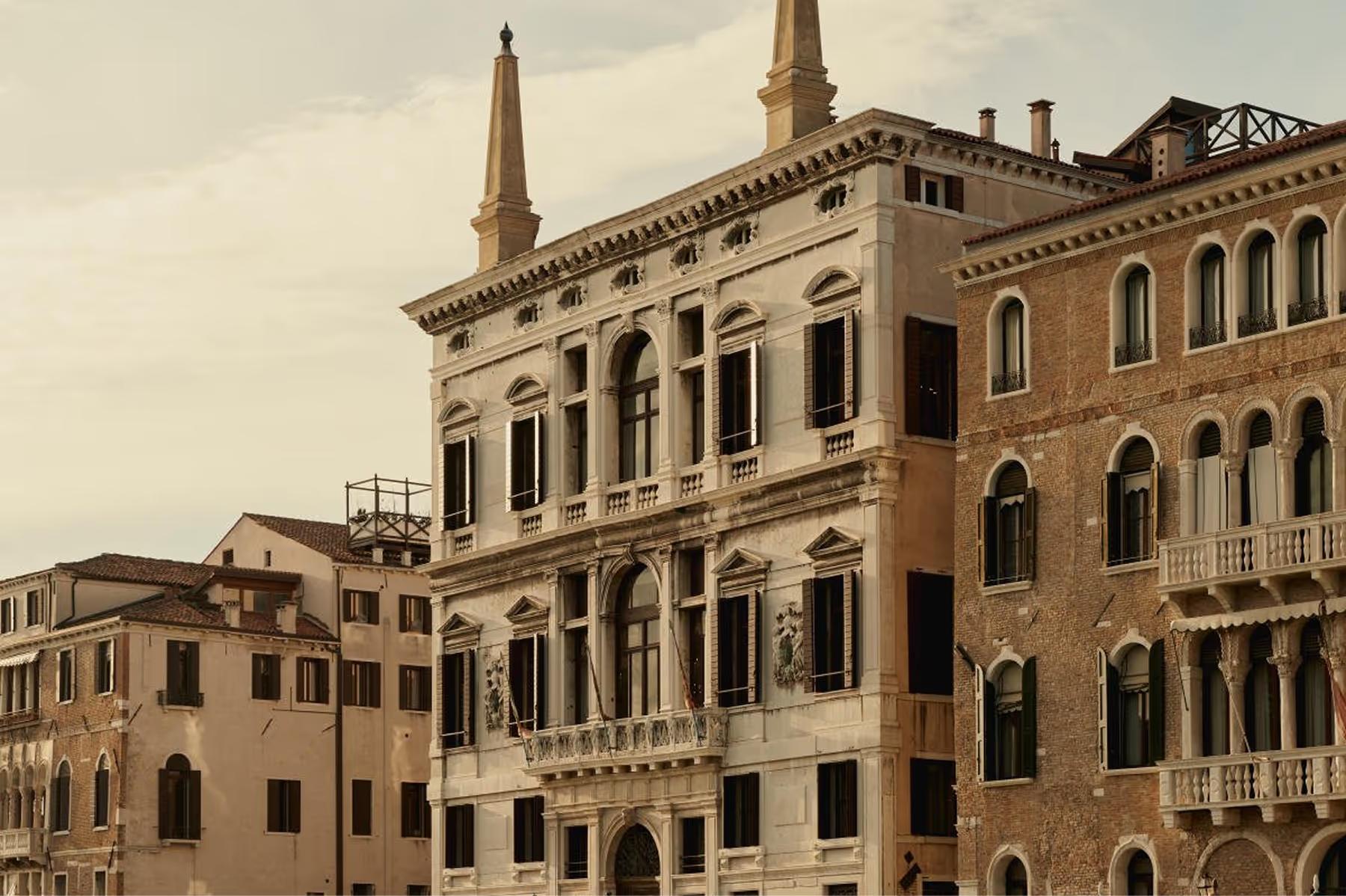 Aman Venice: the palazzo facade with twin spires and ornate detailing facing the Grand Canal