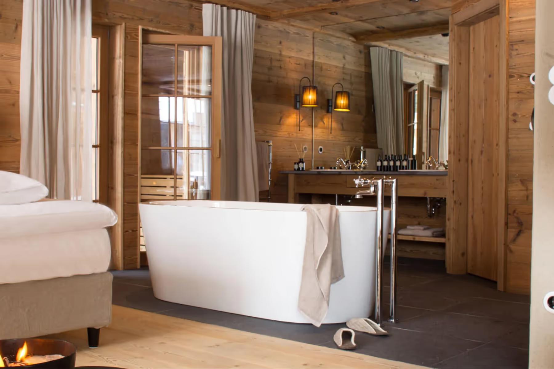 San Luis Retreat: wooden bedroom with a freestanding white soaking tub beside the bed