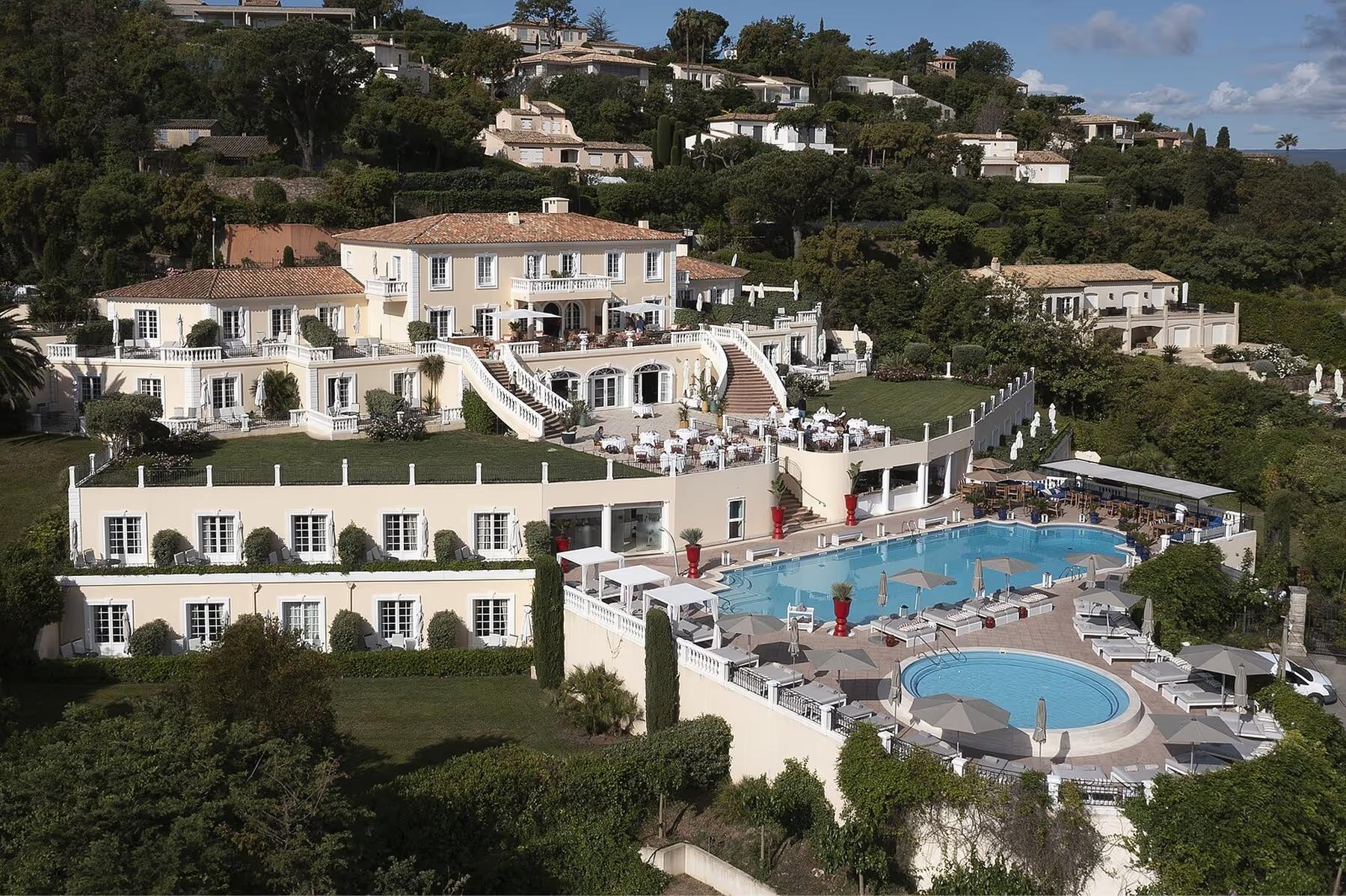 Althoff Villa Belrose: tiered villa facade with cream stone and swimming pools cascading downhill