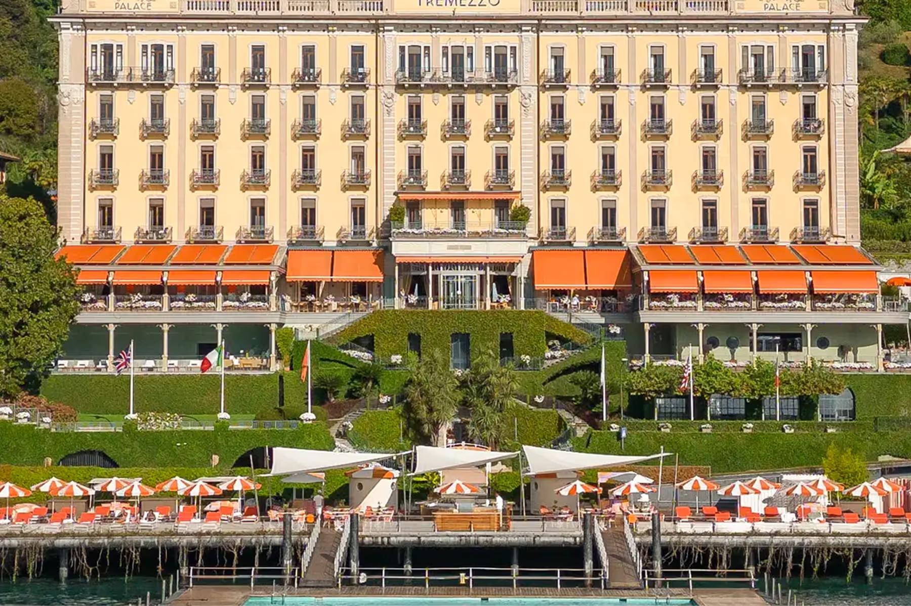 Grand Hotel Tremezzo: the palatial facade of the Art Nouveau hotel with orange awnings facing Lake Como