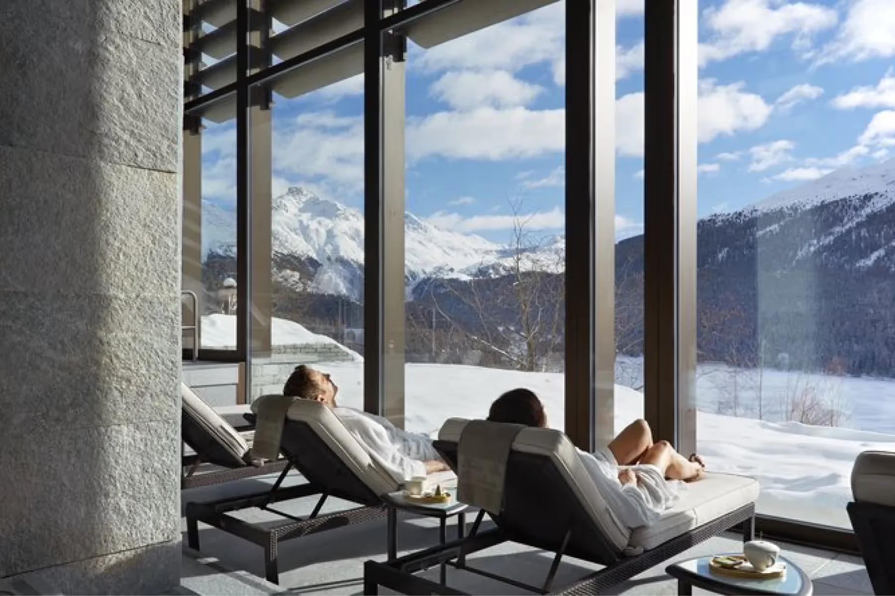 Kulm Hotel St. Moritz: an ice hole in winter ice with a fishing rod set across the opening